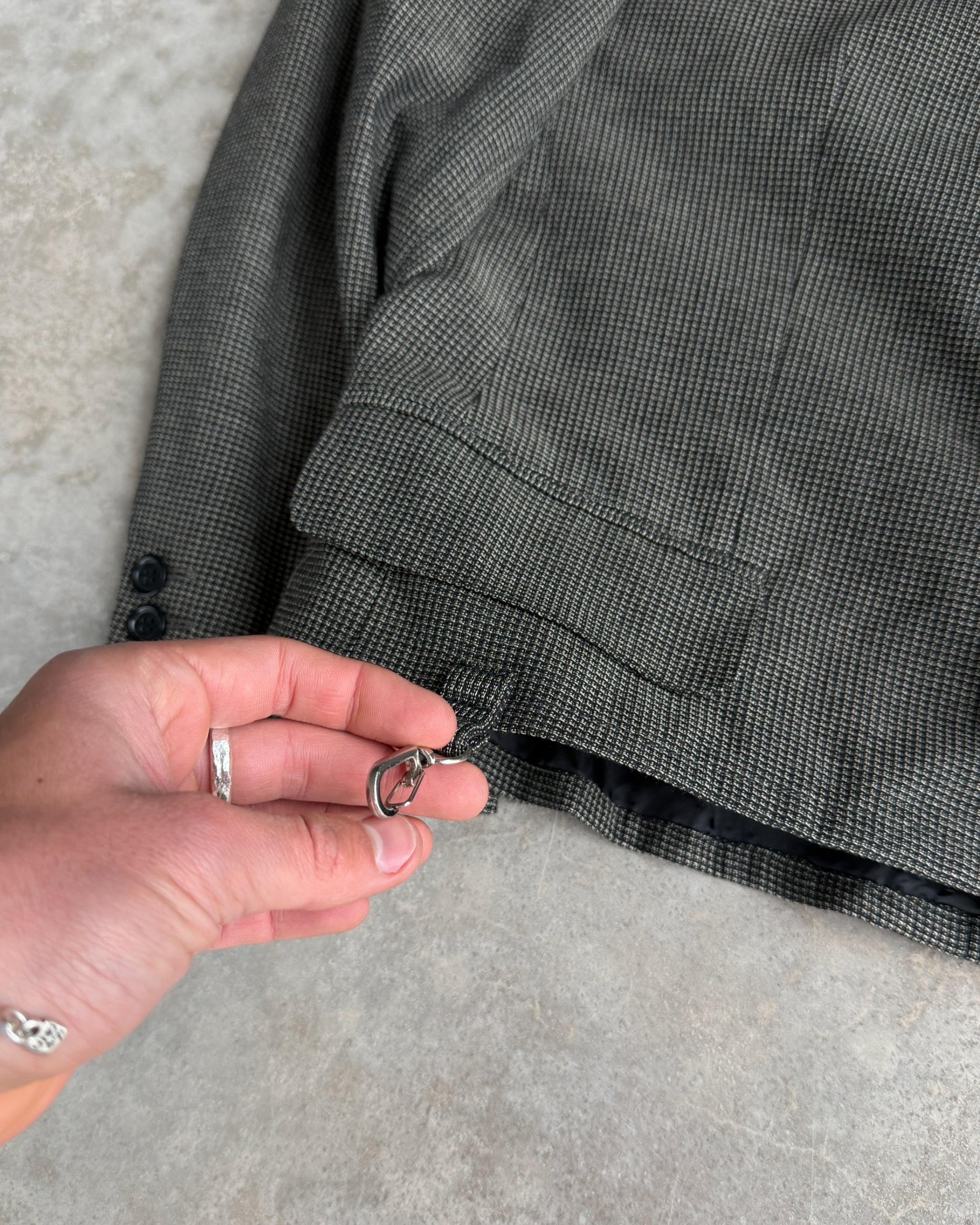 M Classic Altered Wool Jacket with Safety Pins – L-on a concrete background