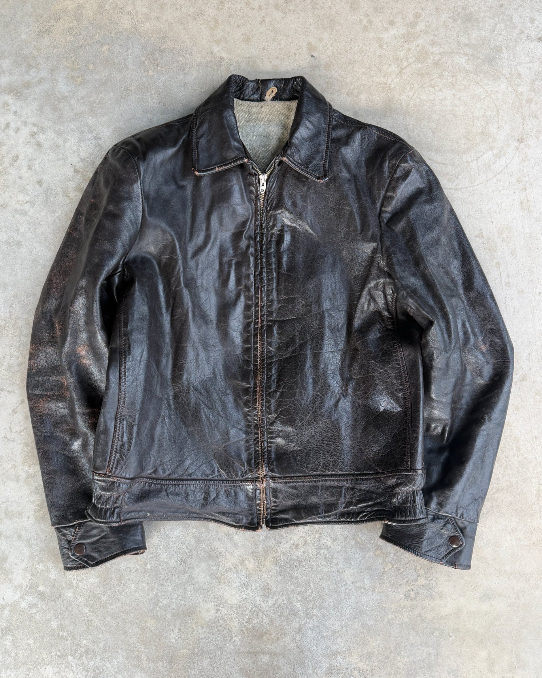 1970s Vintage Leather Jacket with Wool Lining – S-on a concrete background