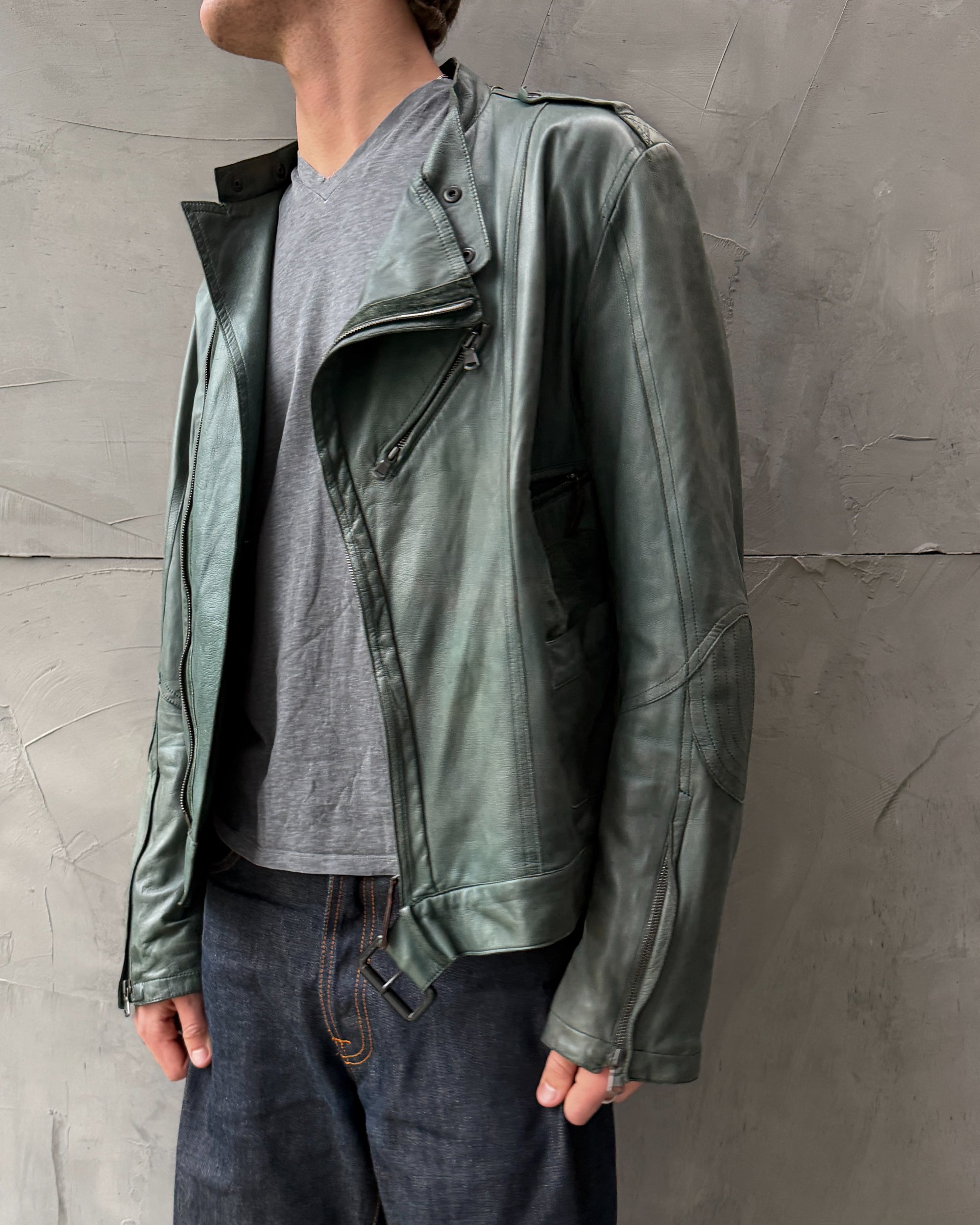 Costume National Homme Green Leather Biker Jacket – M-on a concrete background