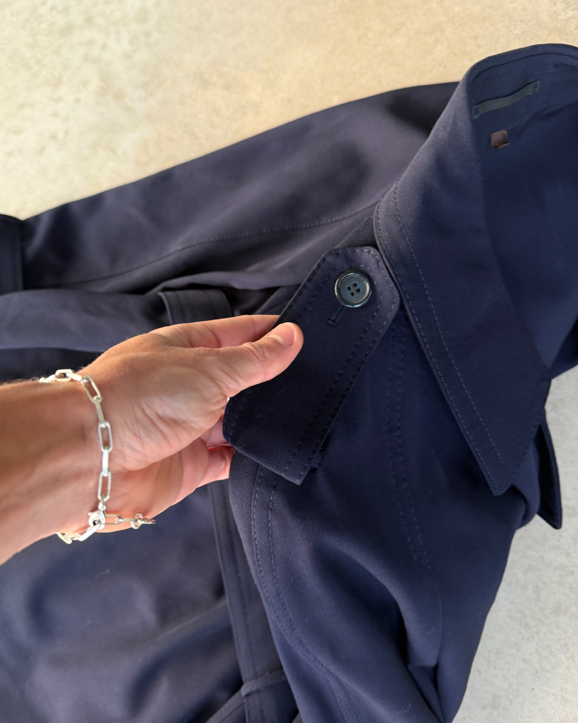 Yves Saint Laurent Wool Double Breasted Mac Coat – M-on a concrete background