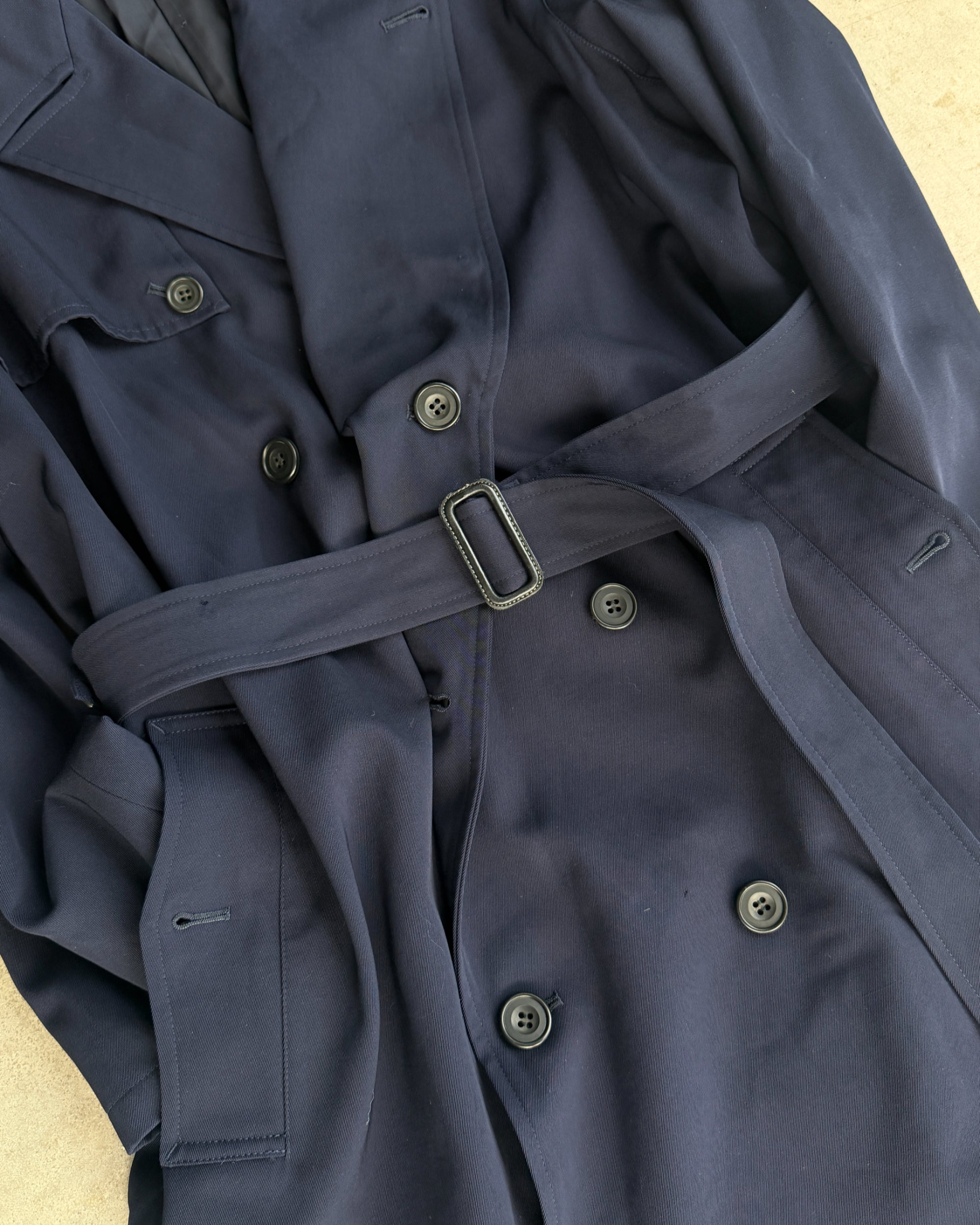 Yohji Yamamoto AW04 Trench Mac Coat – L-on a concrete background