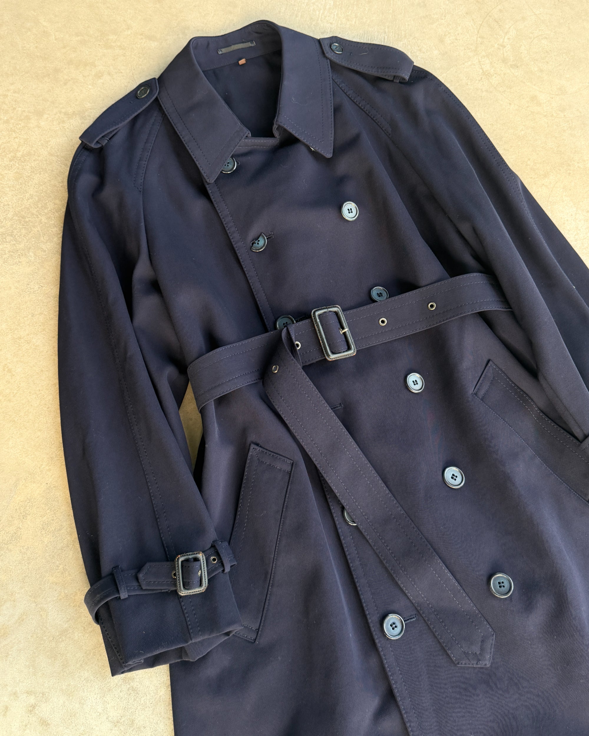 Yves Saint Laurent Wool Double Breasted Mac Coat – M-on a concrete background