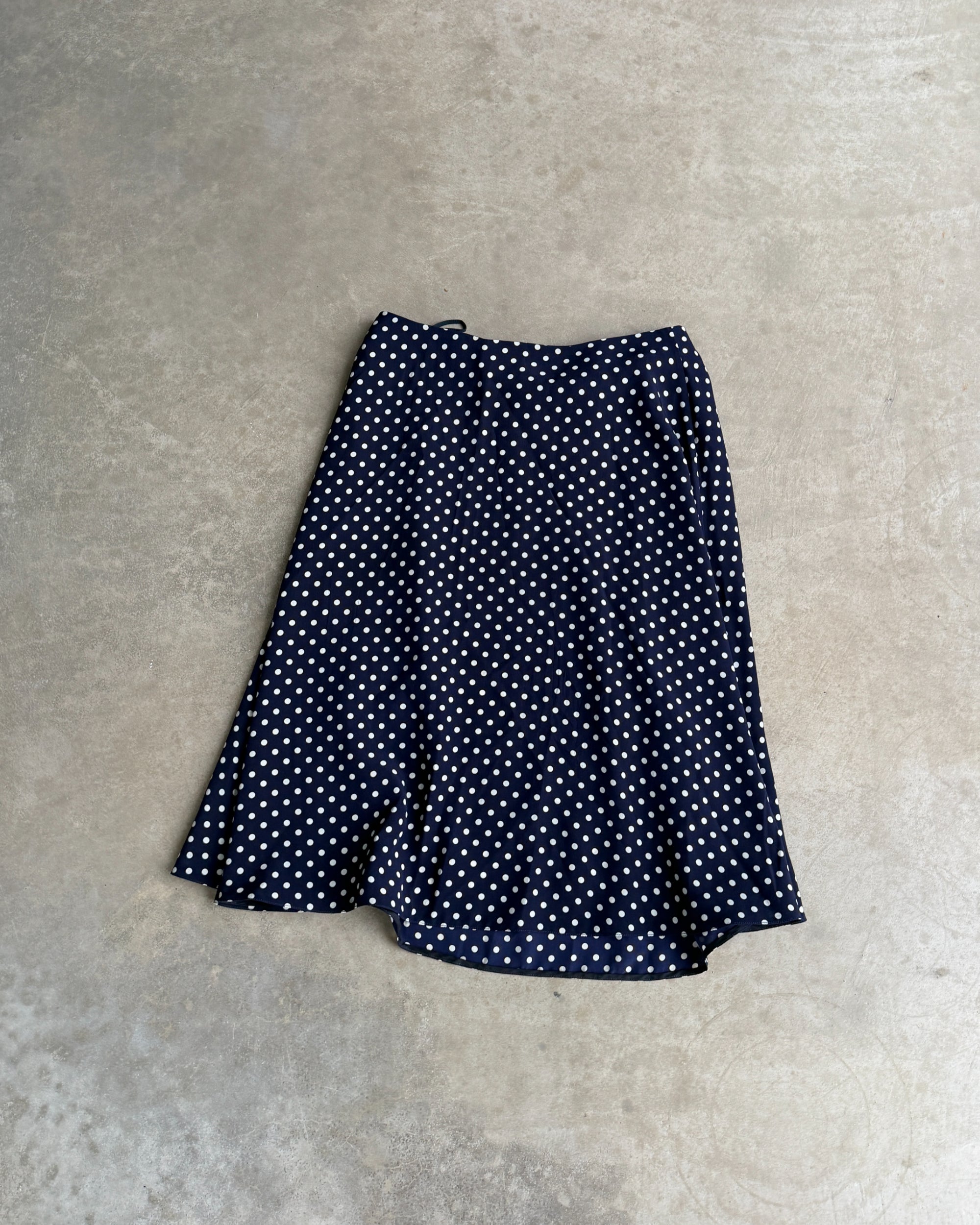Prada Blue Polka Dot Silk Midi Skirt – S-on a concrete background