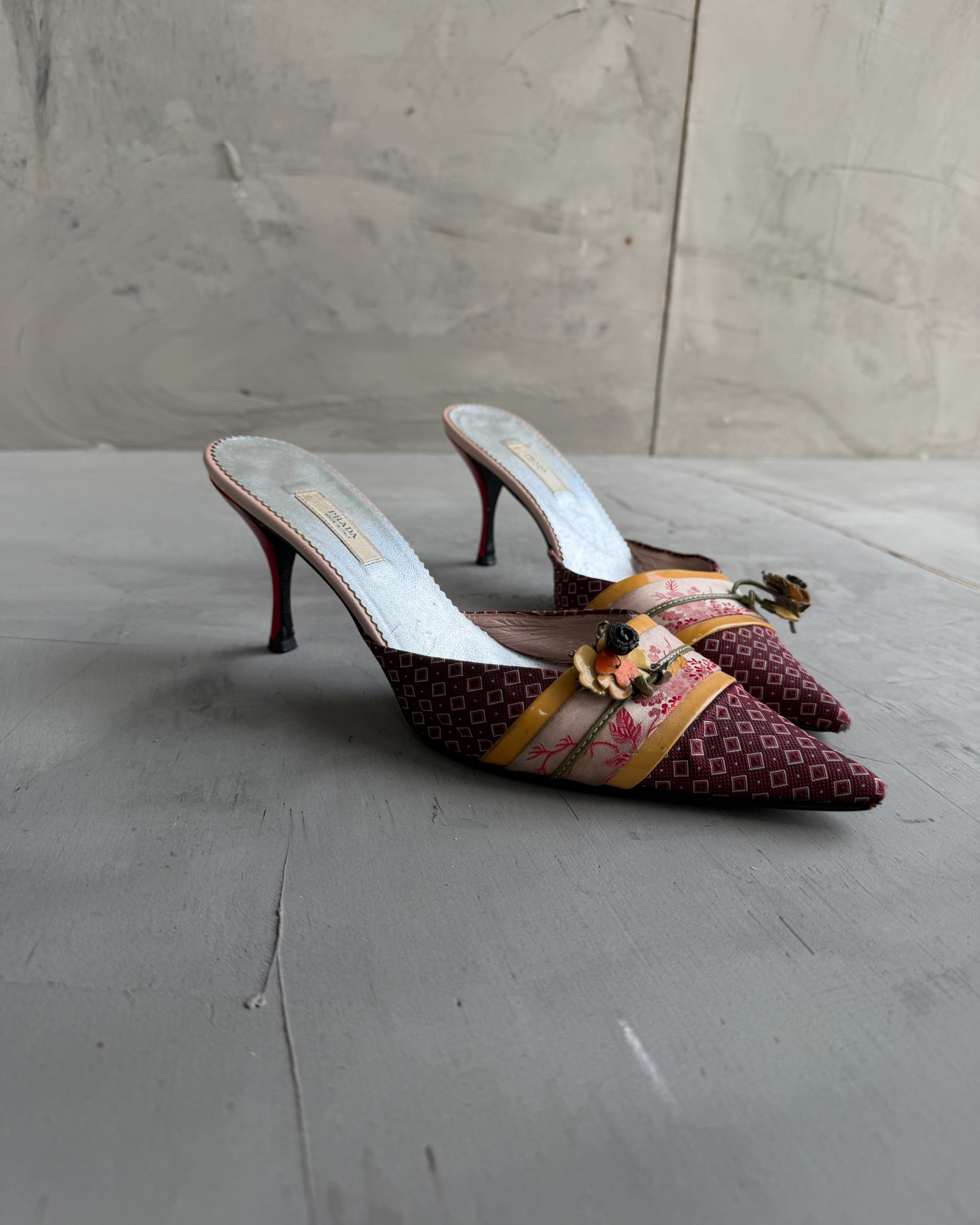 Prada Silk Embellished Kitten Heels – EU 37.5-on a concrete background