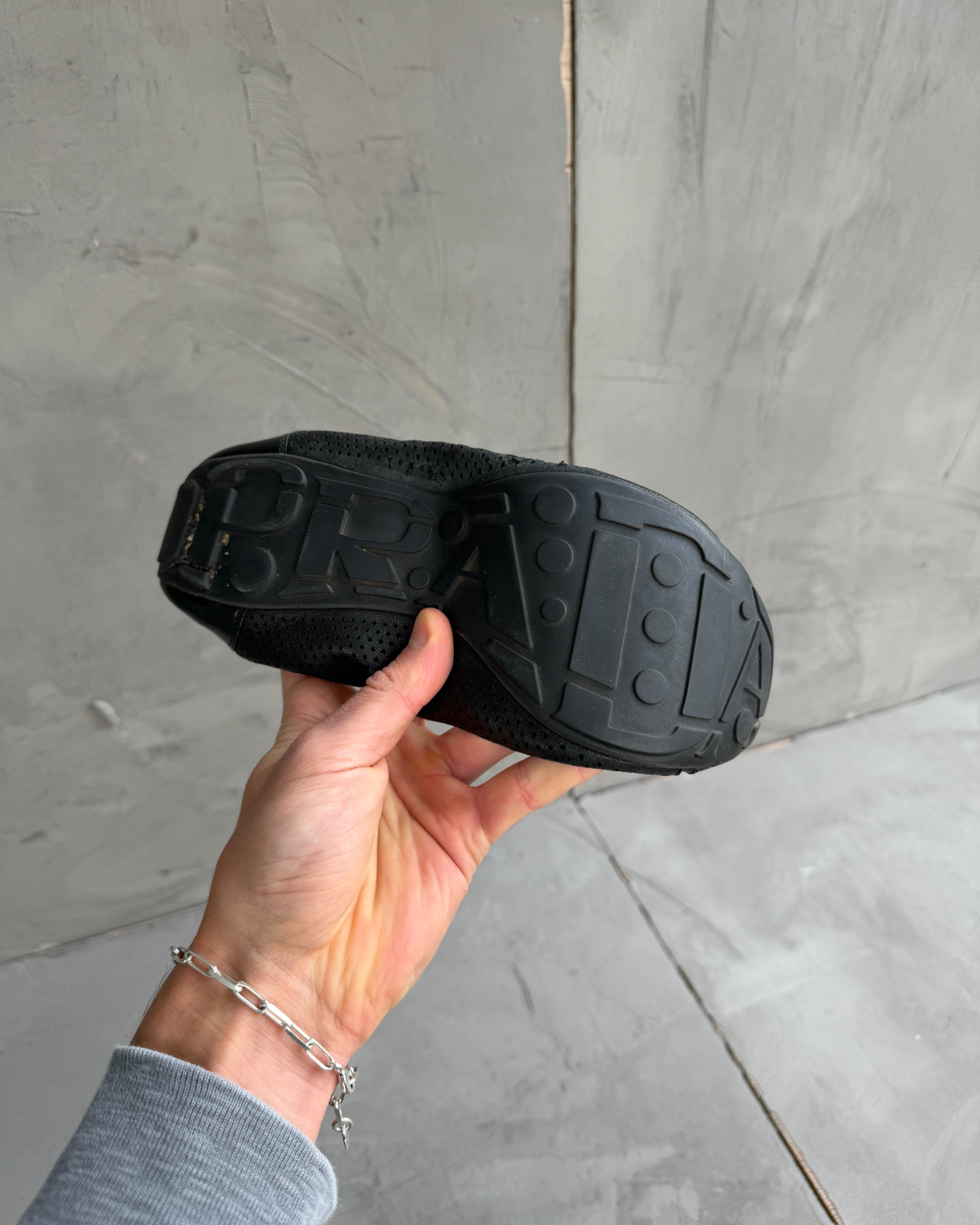 Prada Black Ballet Flats – EU 39-on a concrete background