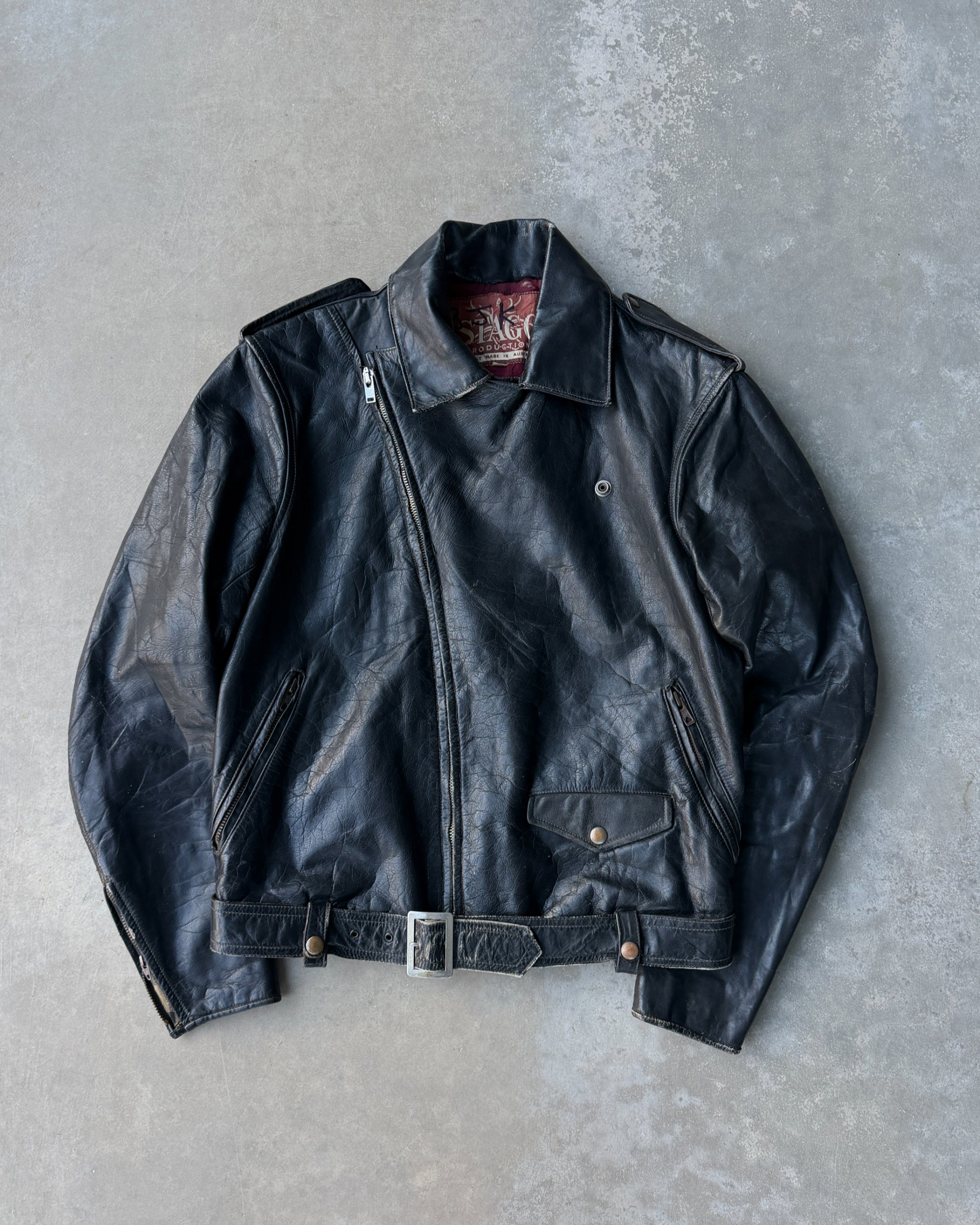 1960s Staggs Leather Moto Jacket – S-on a concrete background