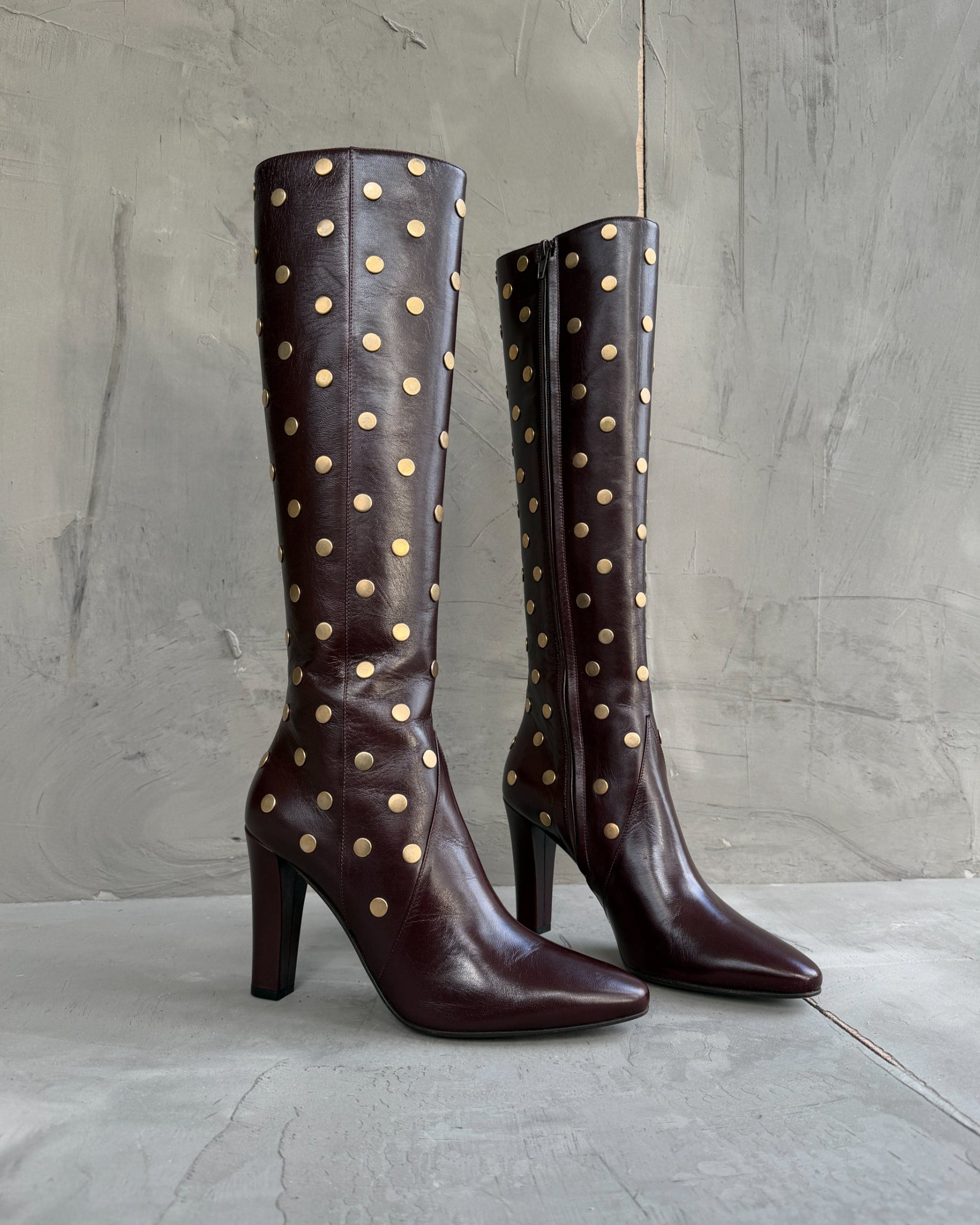 Saint Laurent Studded Leather Heeled Boots – EU 40-on a concrete background