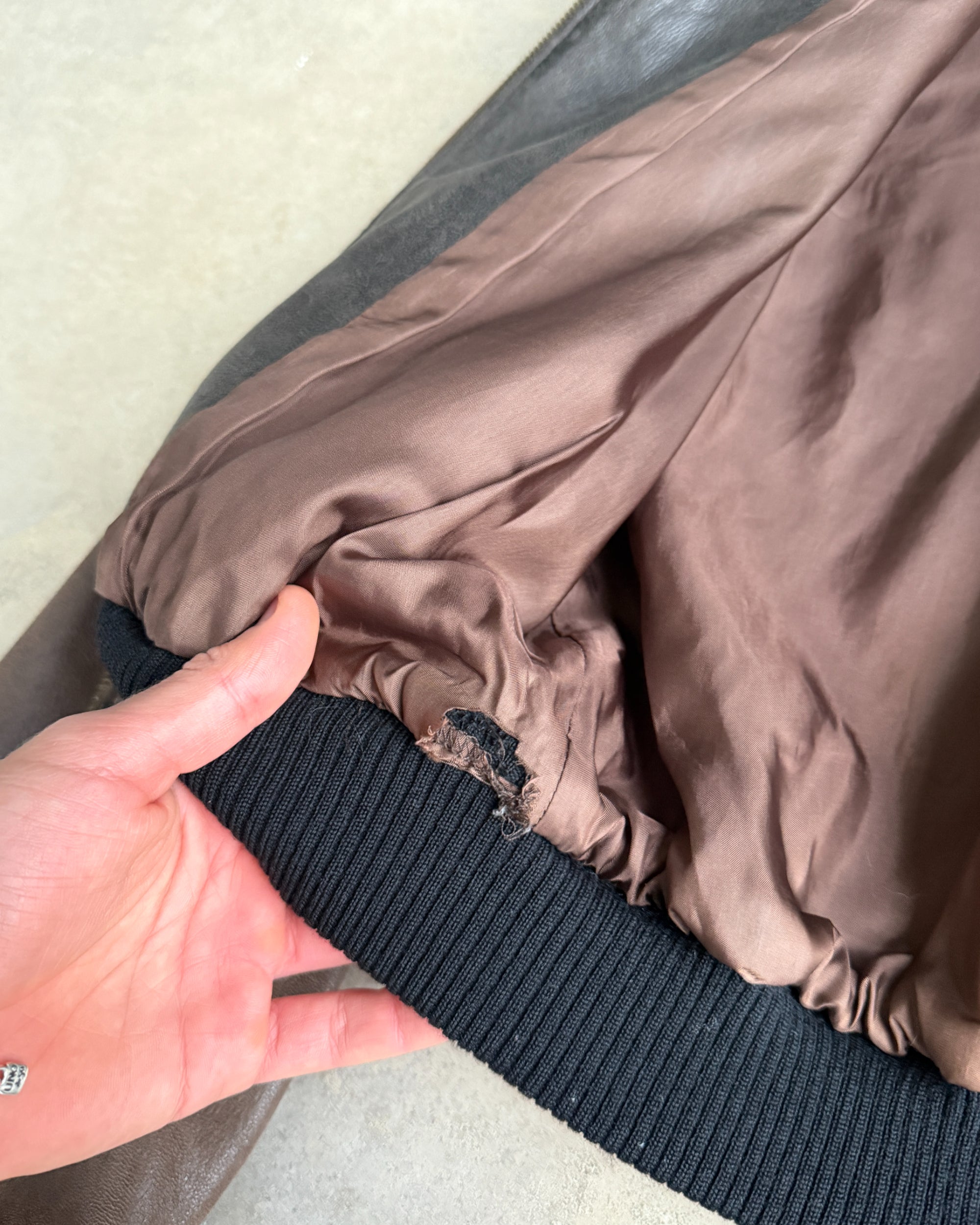 Celine Early 2000s Sheep Leather Bomber Jacket – S-on a concrete background