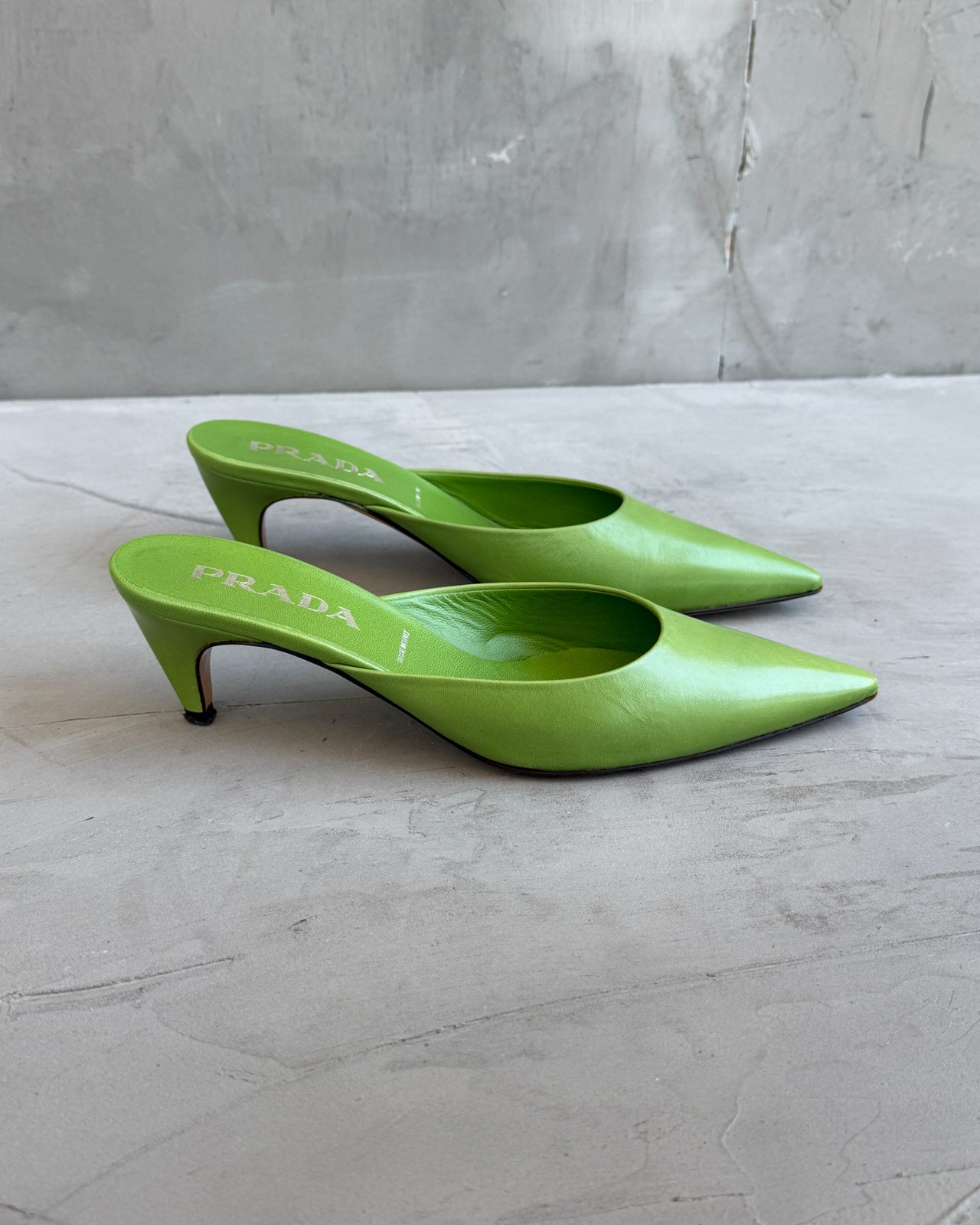 Prada Green Leather Kitten Heel Mule – EU 38-on a concrete background