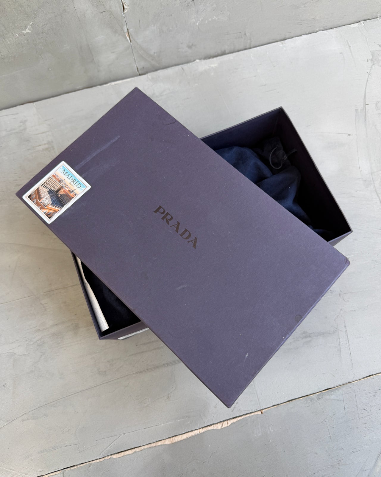 Prada Black Leather Loafers – UK 7-on a concrete background