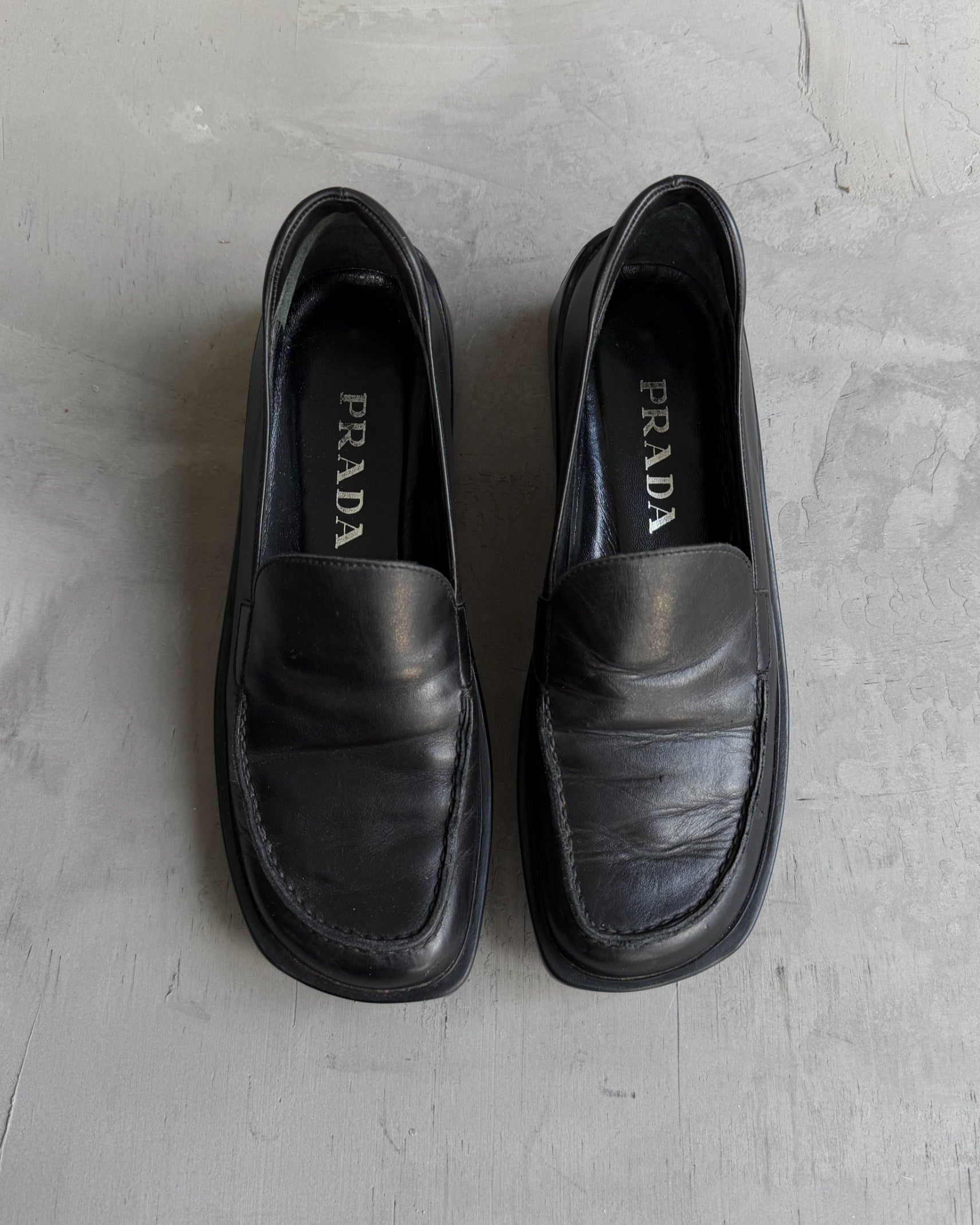 Prada FW99 Leather Extended Sole Loafers – EU 36-on a concrete background