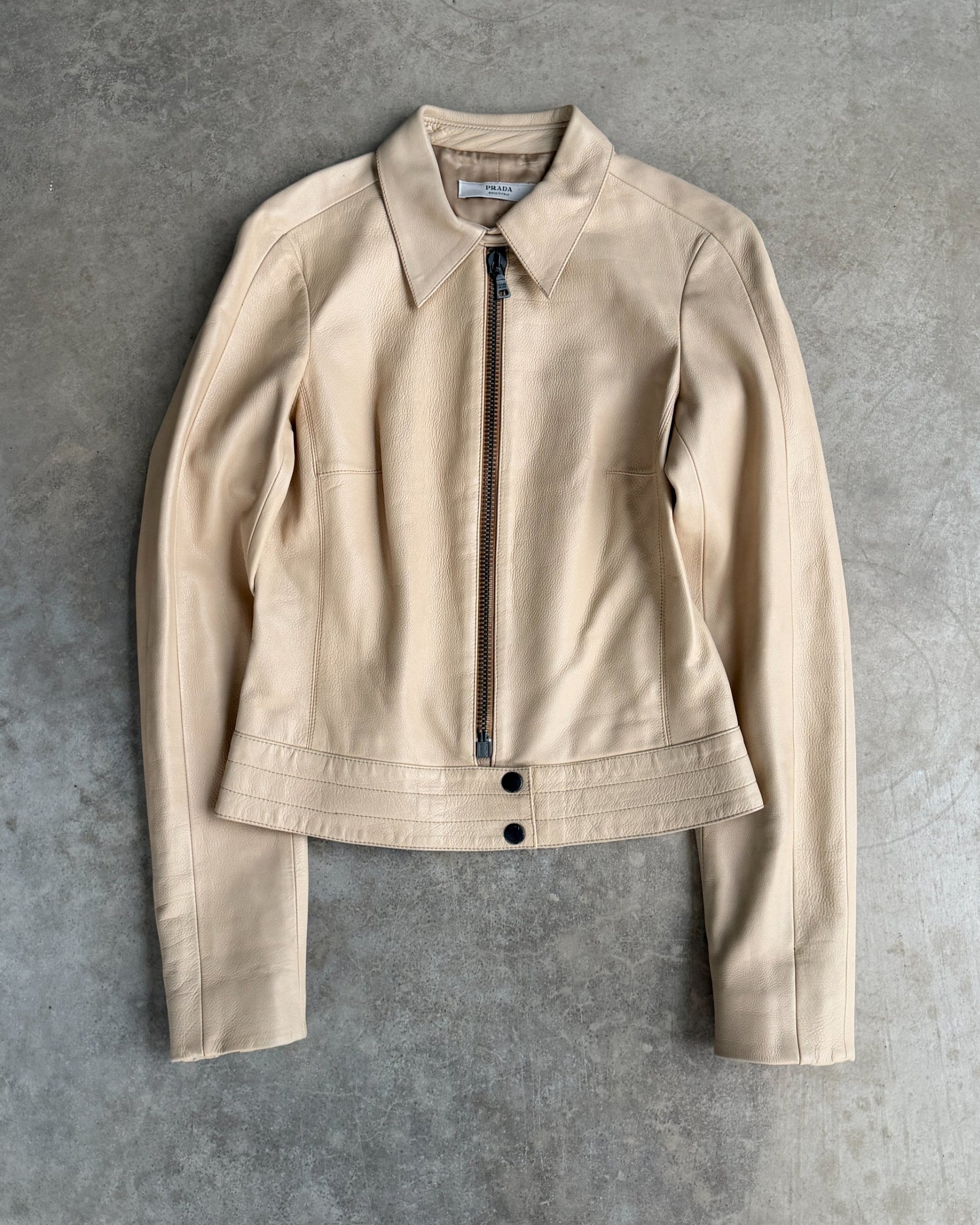 Prada Beige Leather Belted Jacket – M-on a concrete background