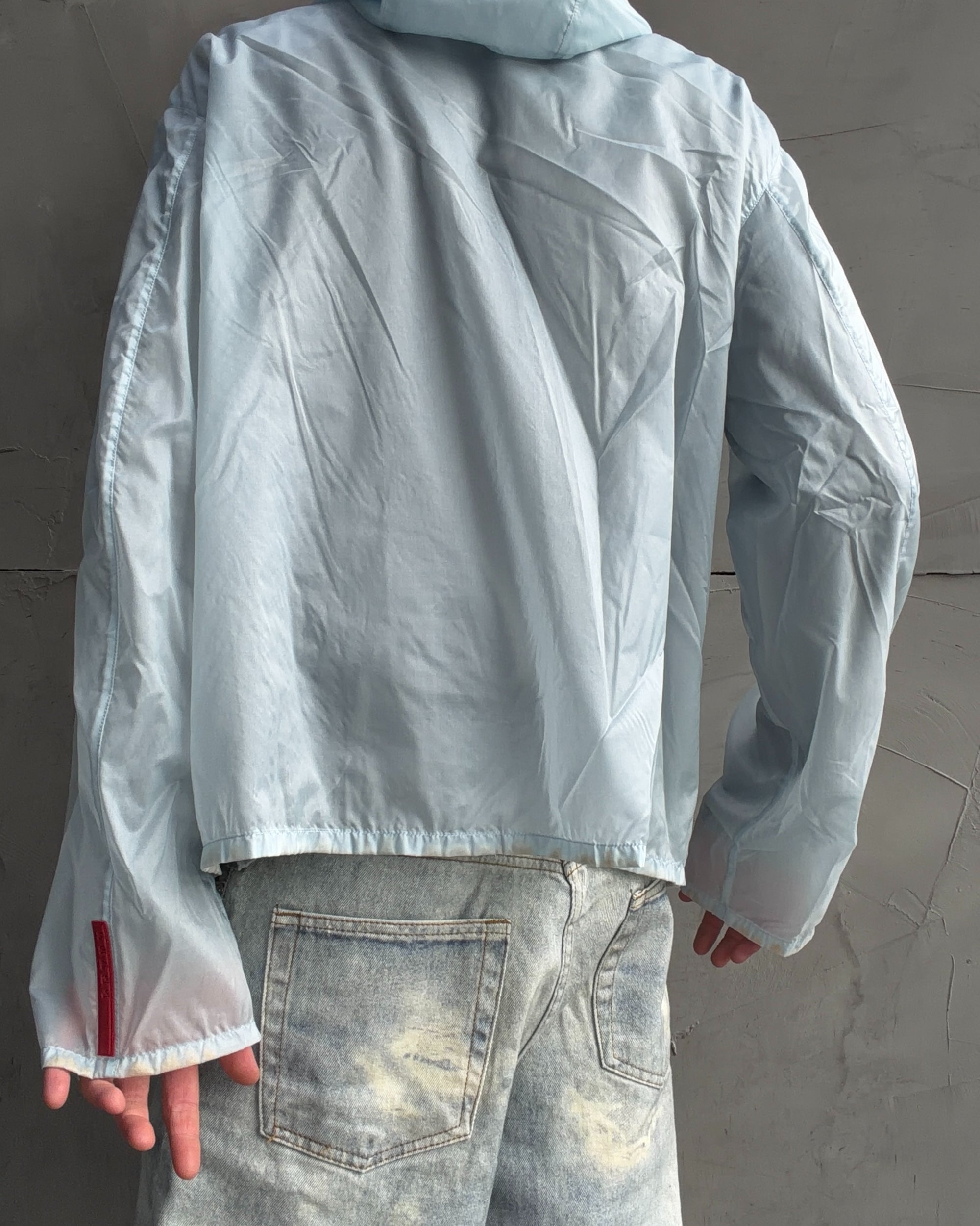 Prada SS99 Transparent Nylon Jacket – XL-on a concrete background