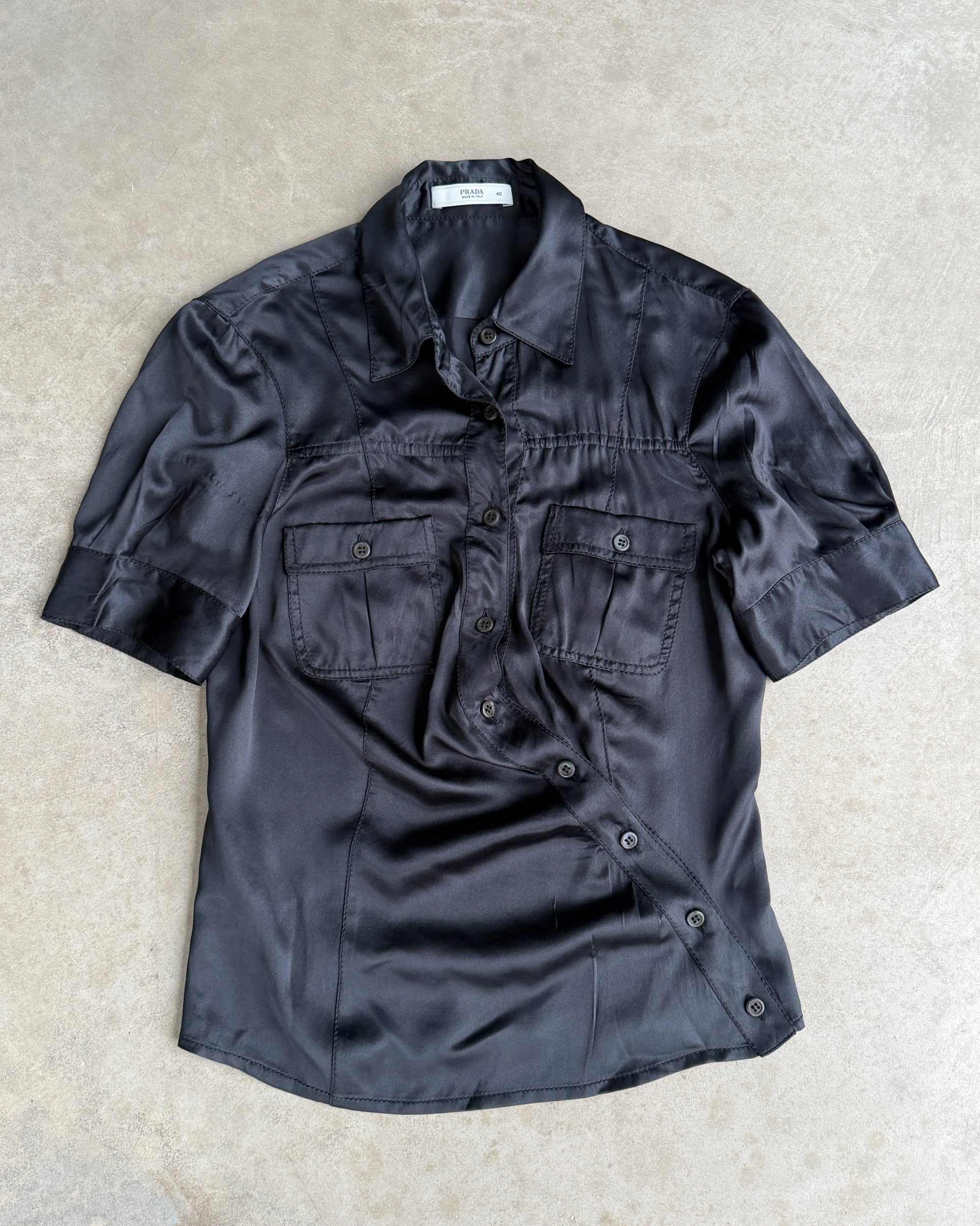 Prada Silk Asymmetric Button-Up Shirt – S-on a concrete background