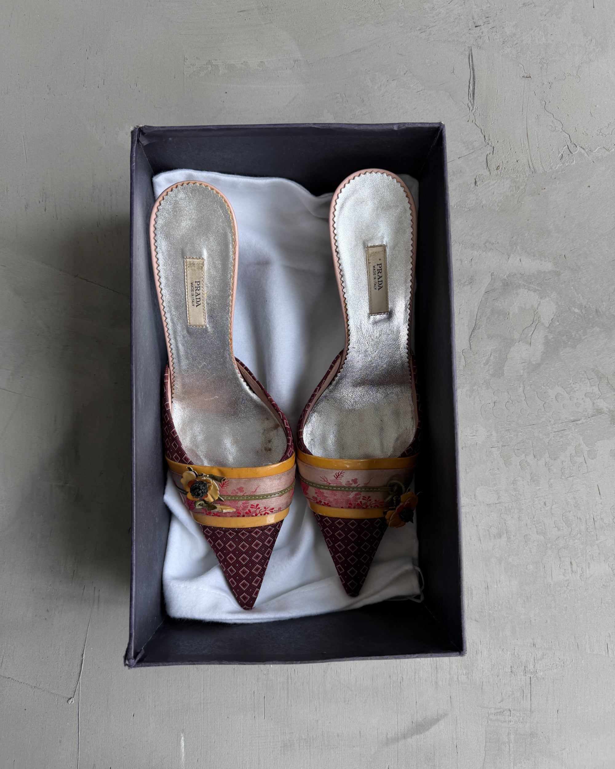 Prada Silk Embellished Kitten Heels – EU 37.5-on a concrete background