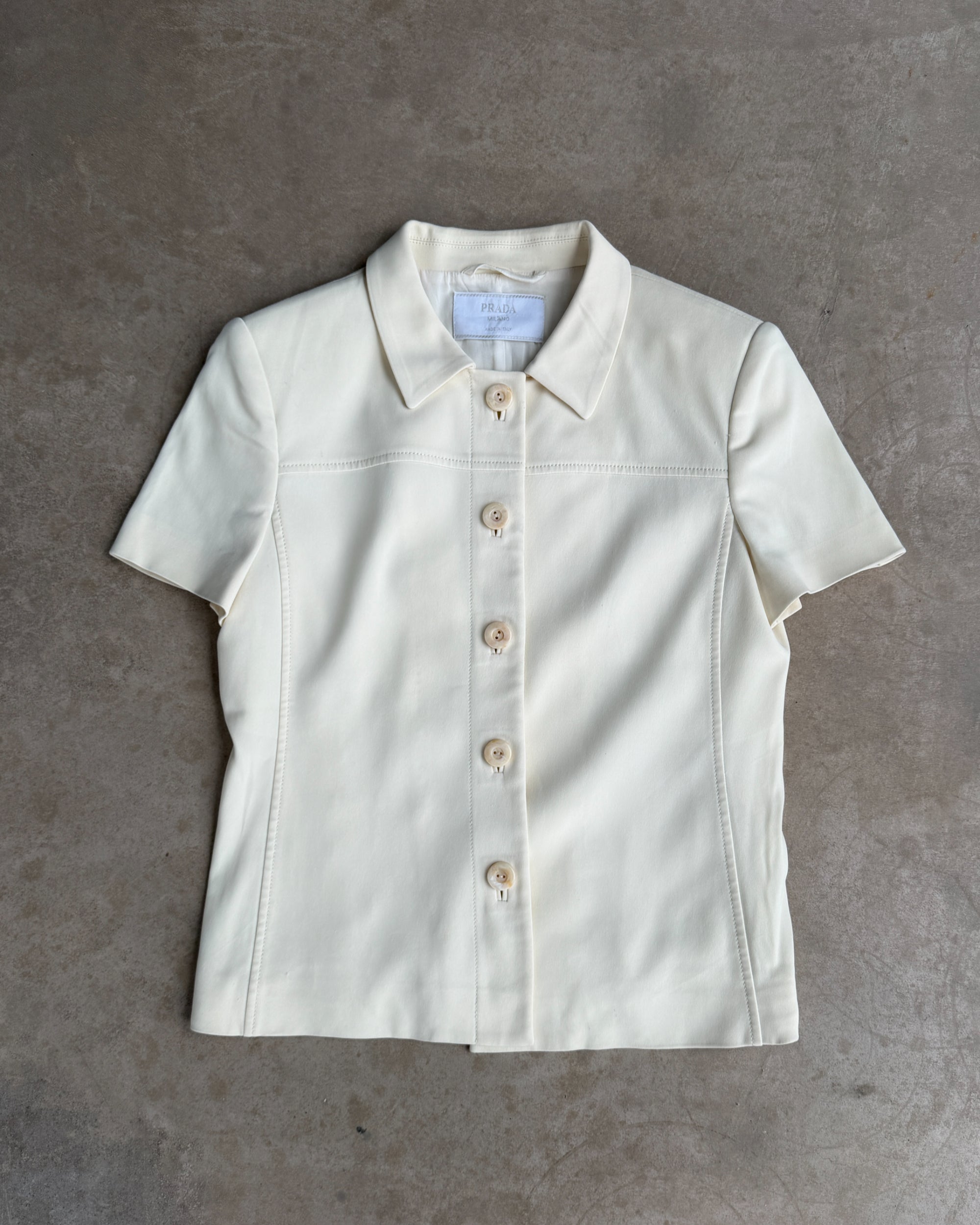 Prada Padded Shoulder Short Sleeve Shirt – M-on a concrete background