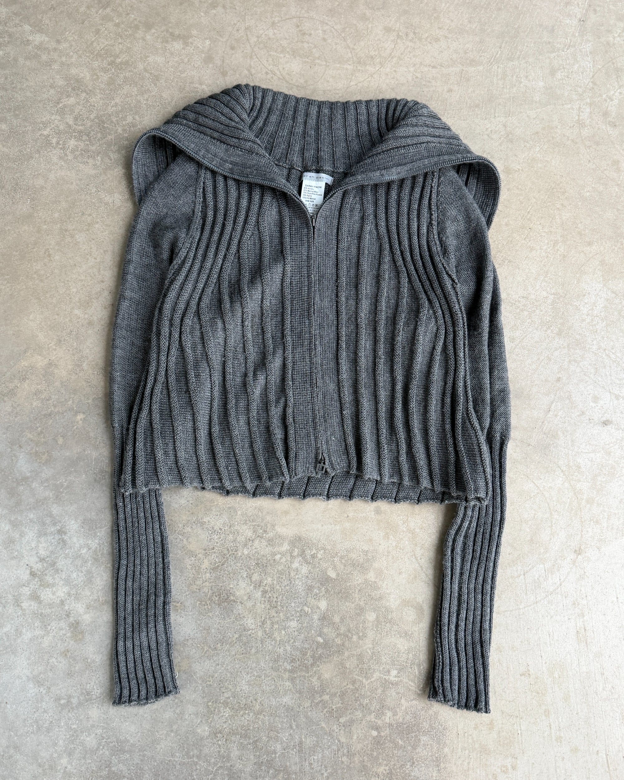Sarah Pacini Zip-Down Cardigan – One Size-on a concrete background