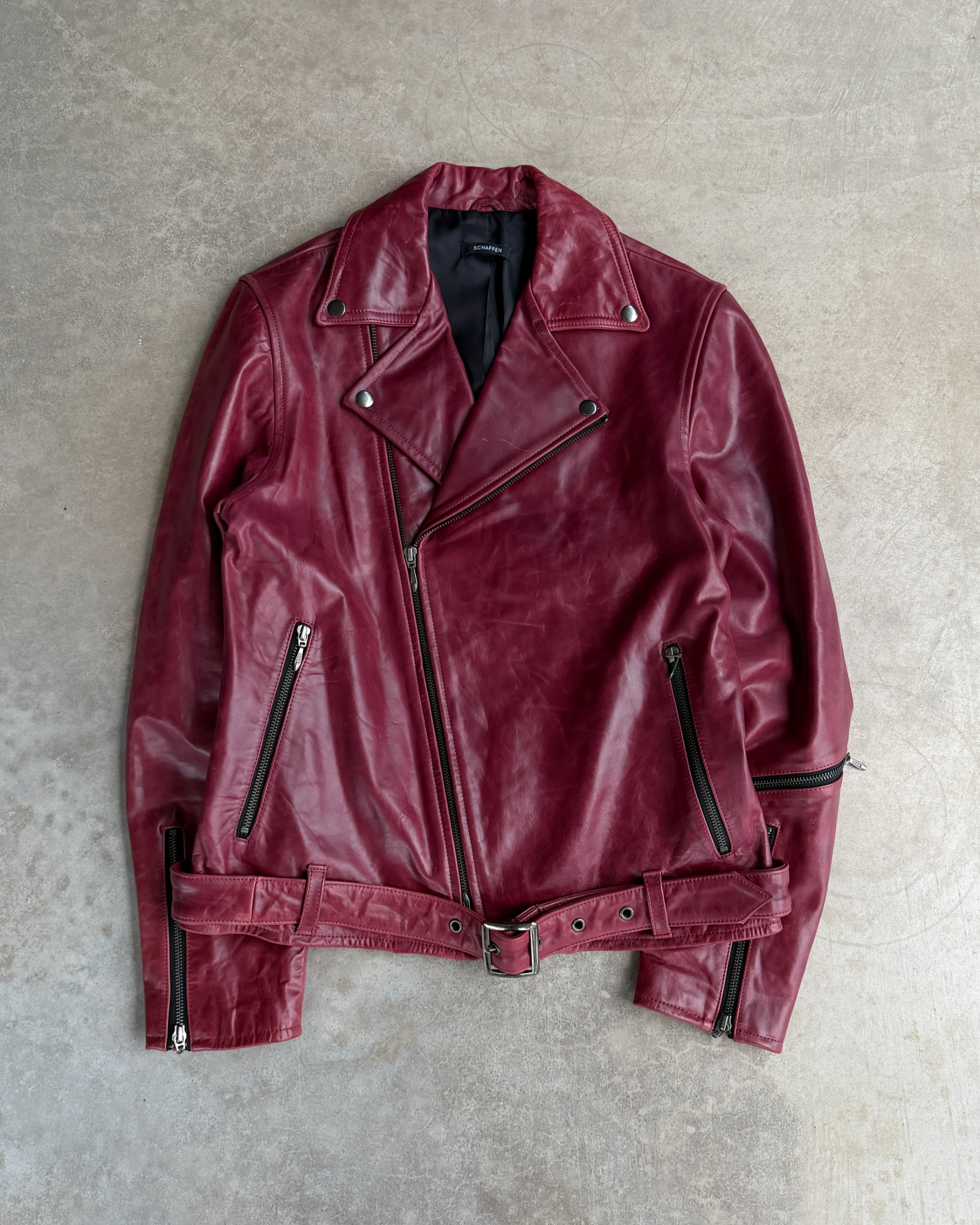 Scheffen Red Horse Leather Biker Jacket – L-on a concrete background