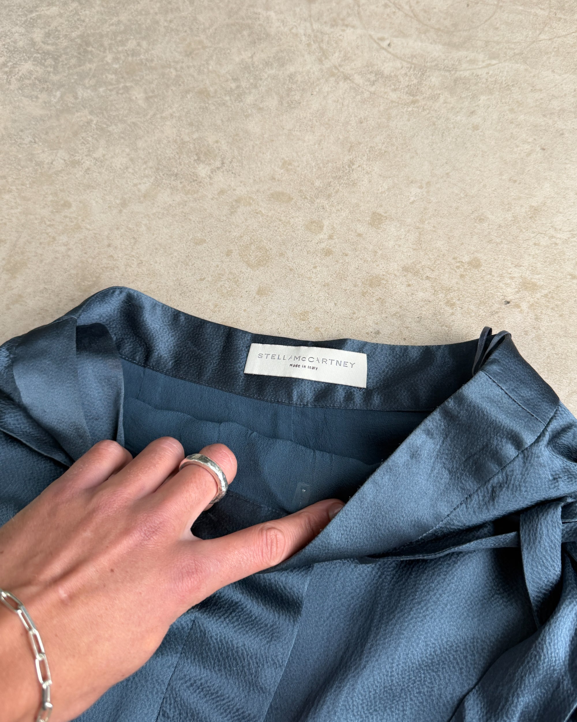 Stella McCartney Silk Wrap Midi Skirt – XS–S-on a concrete background