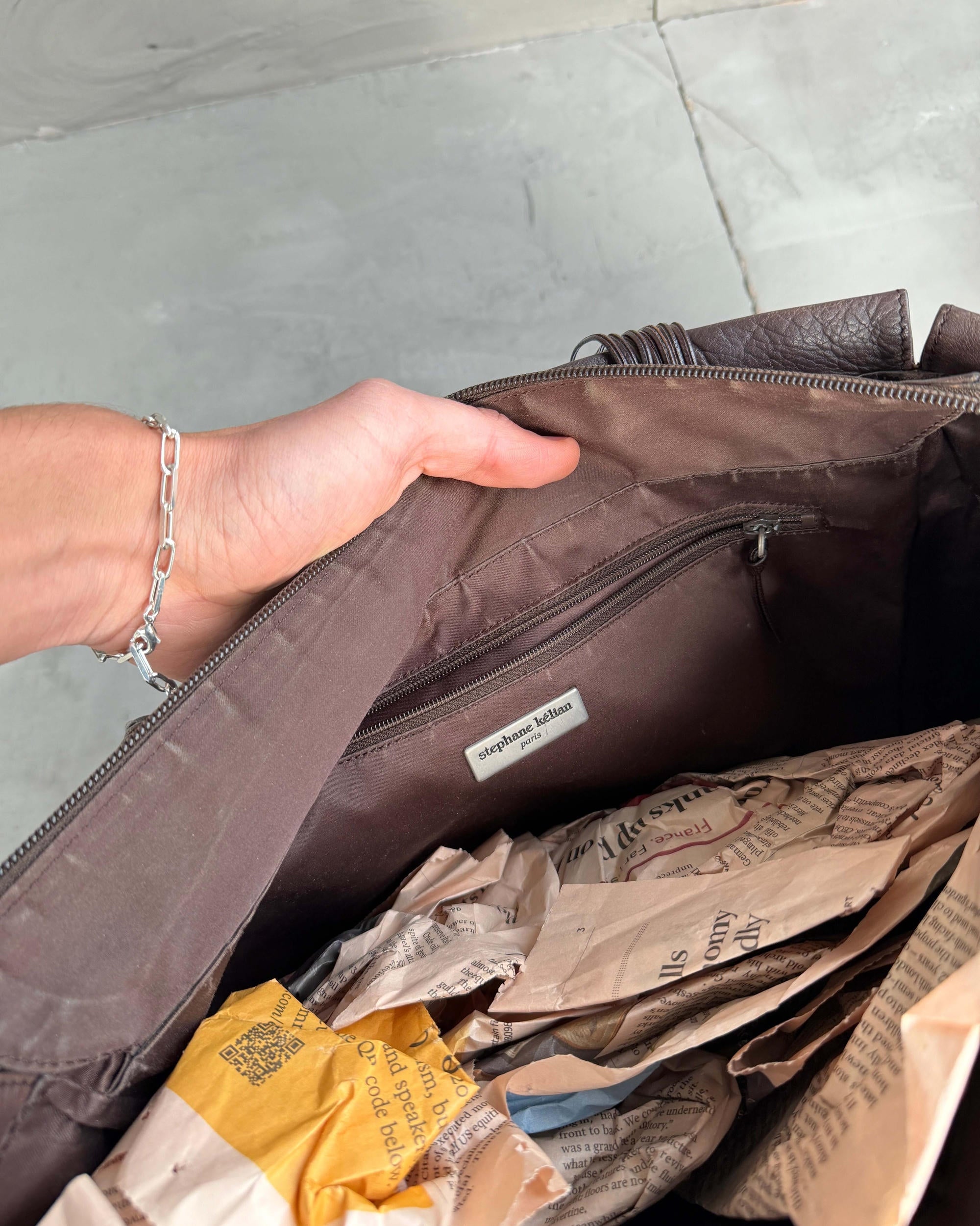 Stephane Kellan Leather Tote Bag-on a concrete background