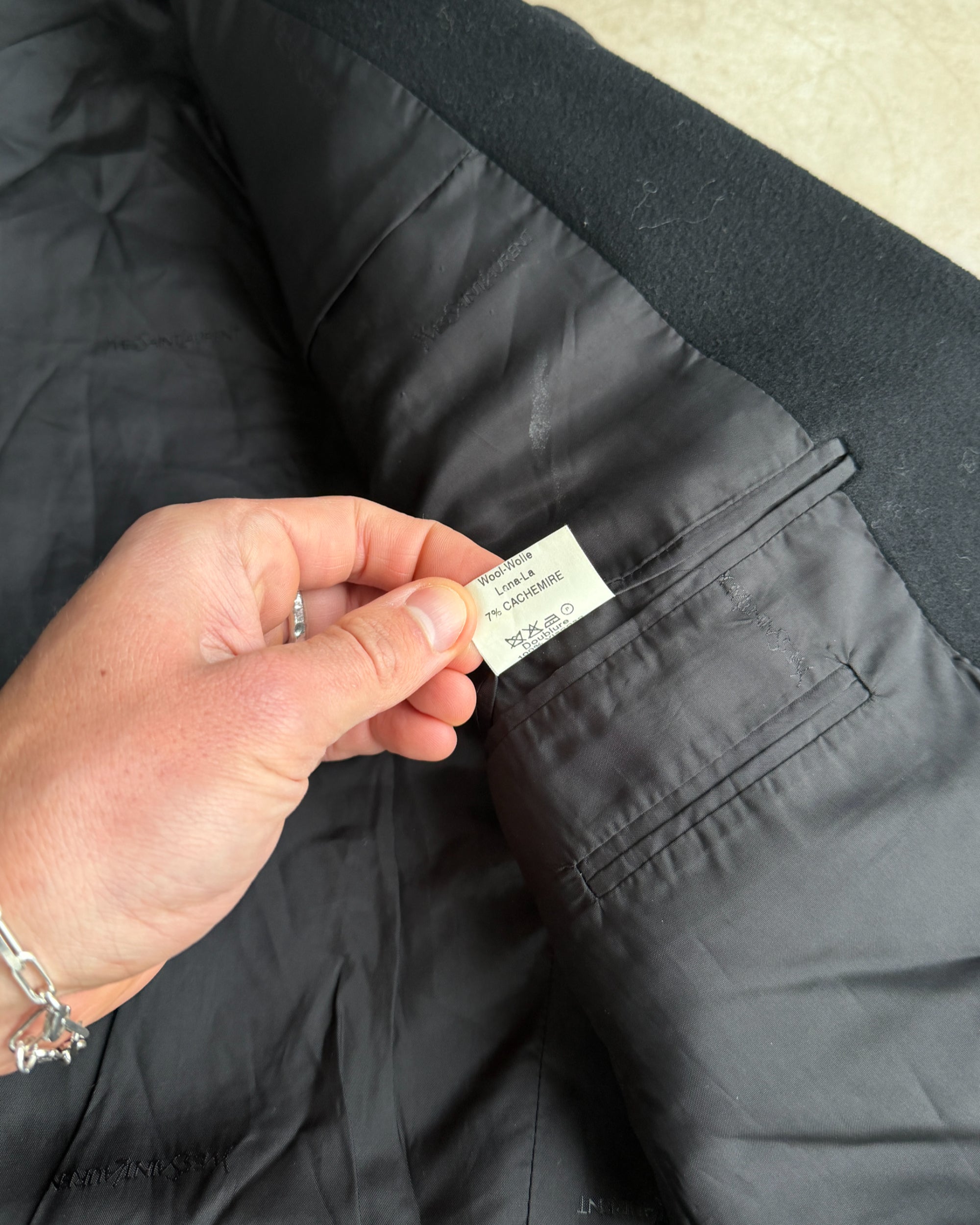 Yves Saint Laurent Pour Homme Wool and Cashmere Blazer – L-on a concrete background