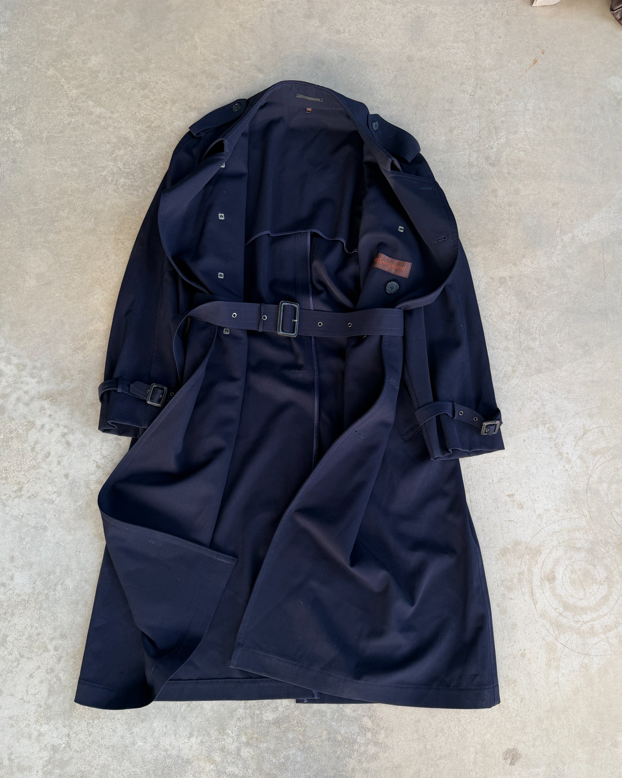 Yves Saint Laurent Wool Double Breasted Mac Coat – M-on a concrete background
