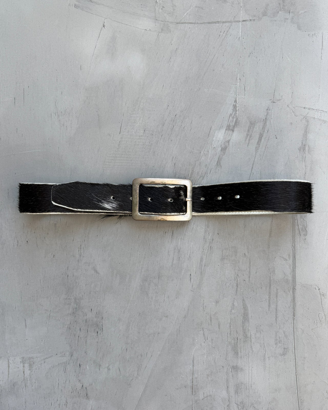 Brown Leather and Pony Hair Belt-on a concrete background