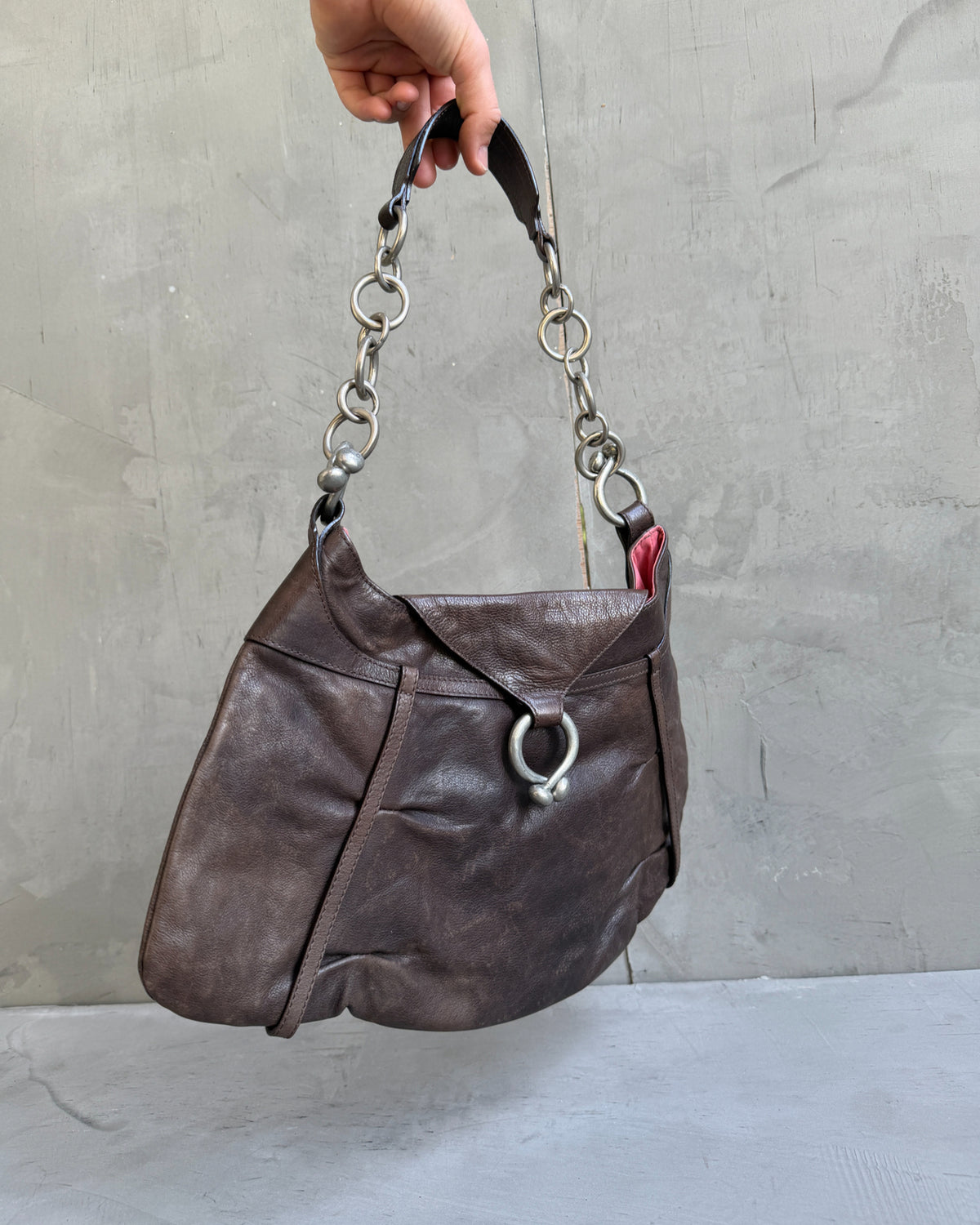 Kenzo Brown Leather Shoulder Bag-on a concrete background