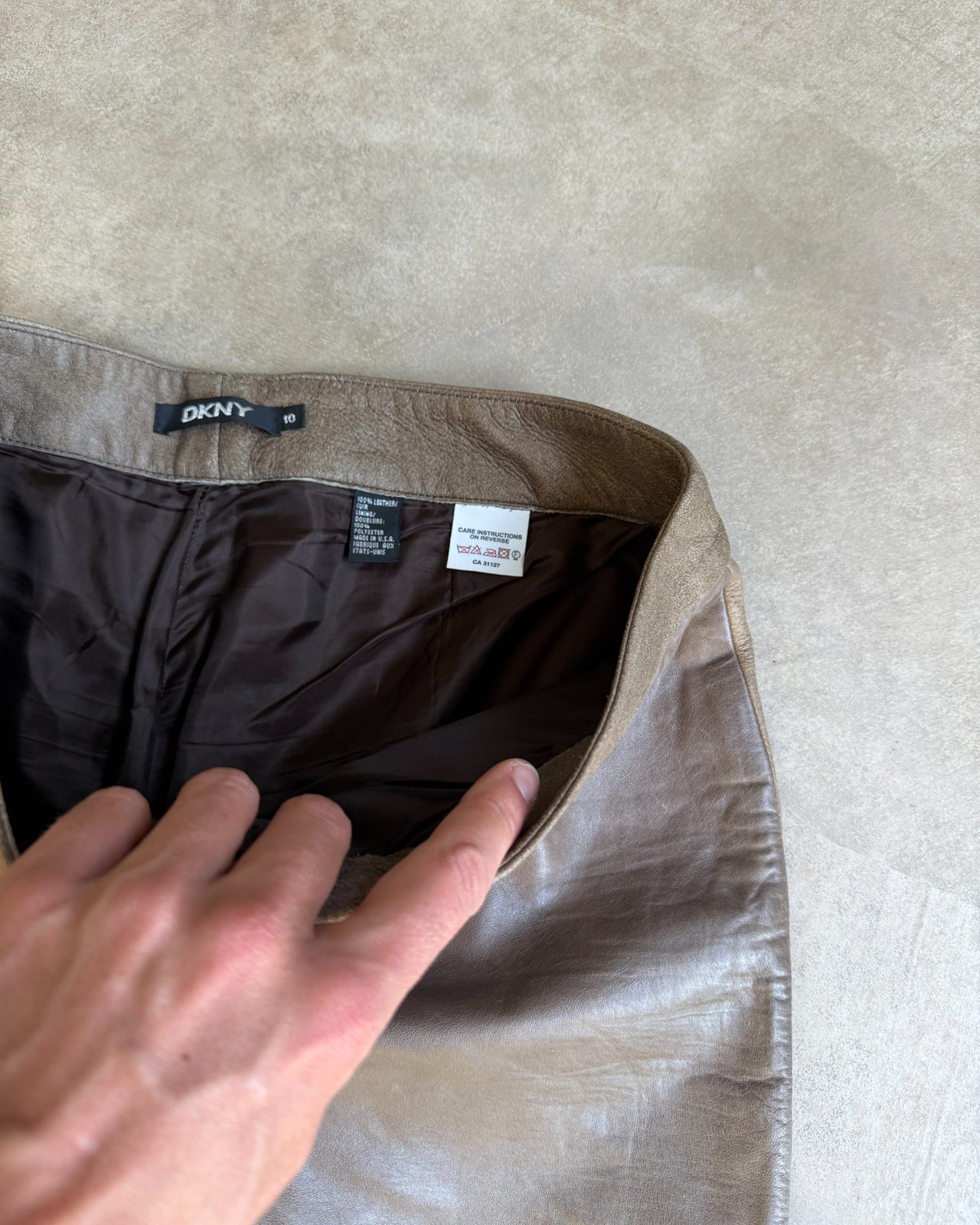 DKNY Brown Two Tone Wide Leg Leather Trousers – S/M-on a concrete background