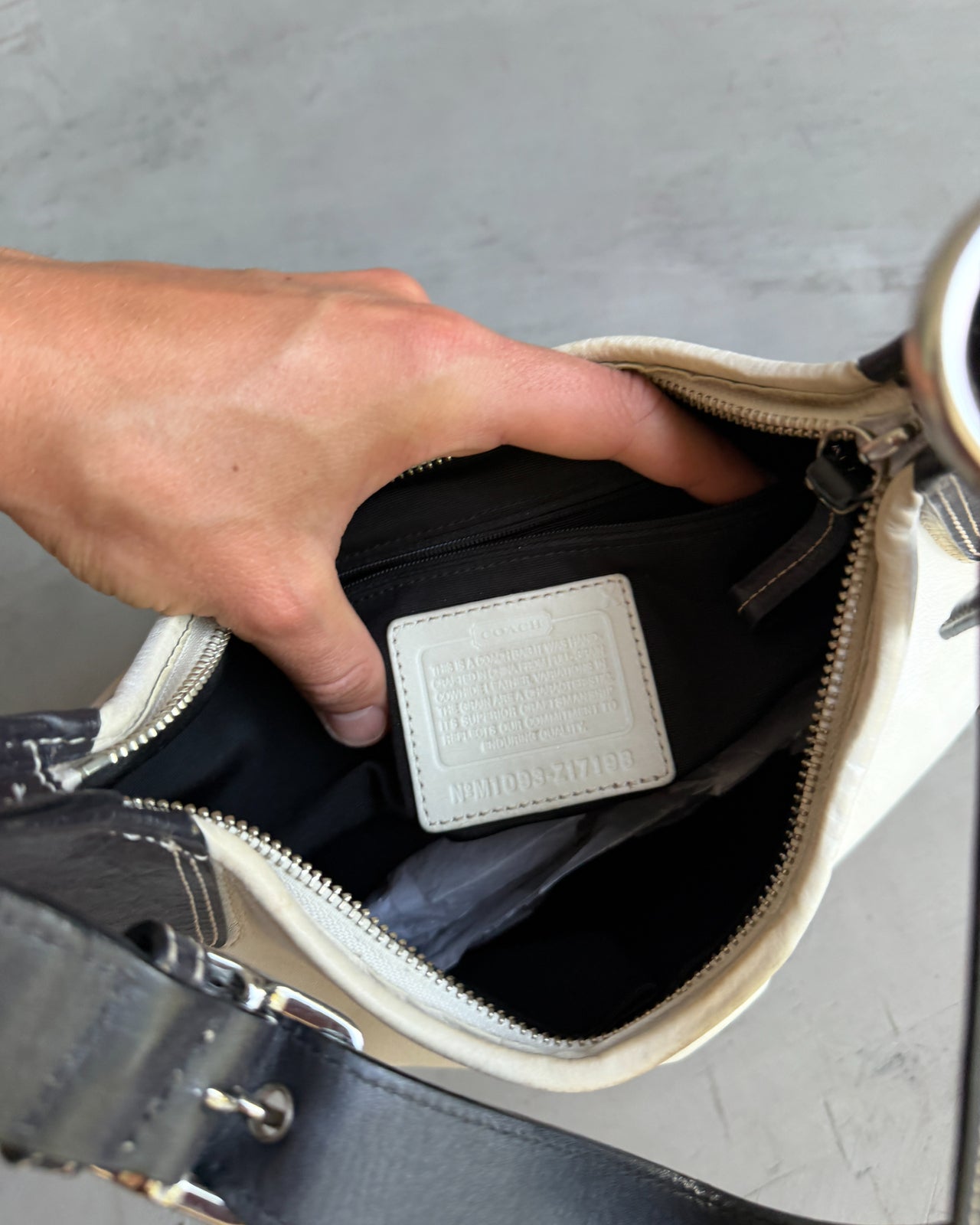 Coach Two Tone Leather Shoulder Bag-on a concrete background