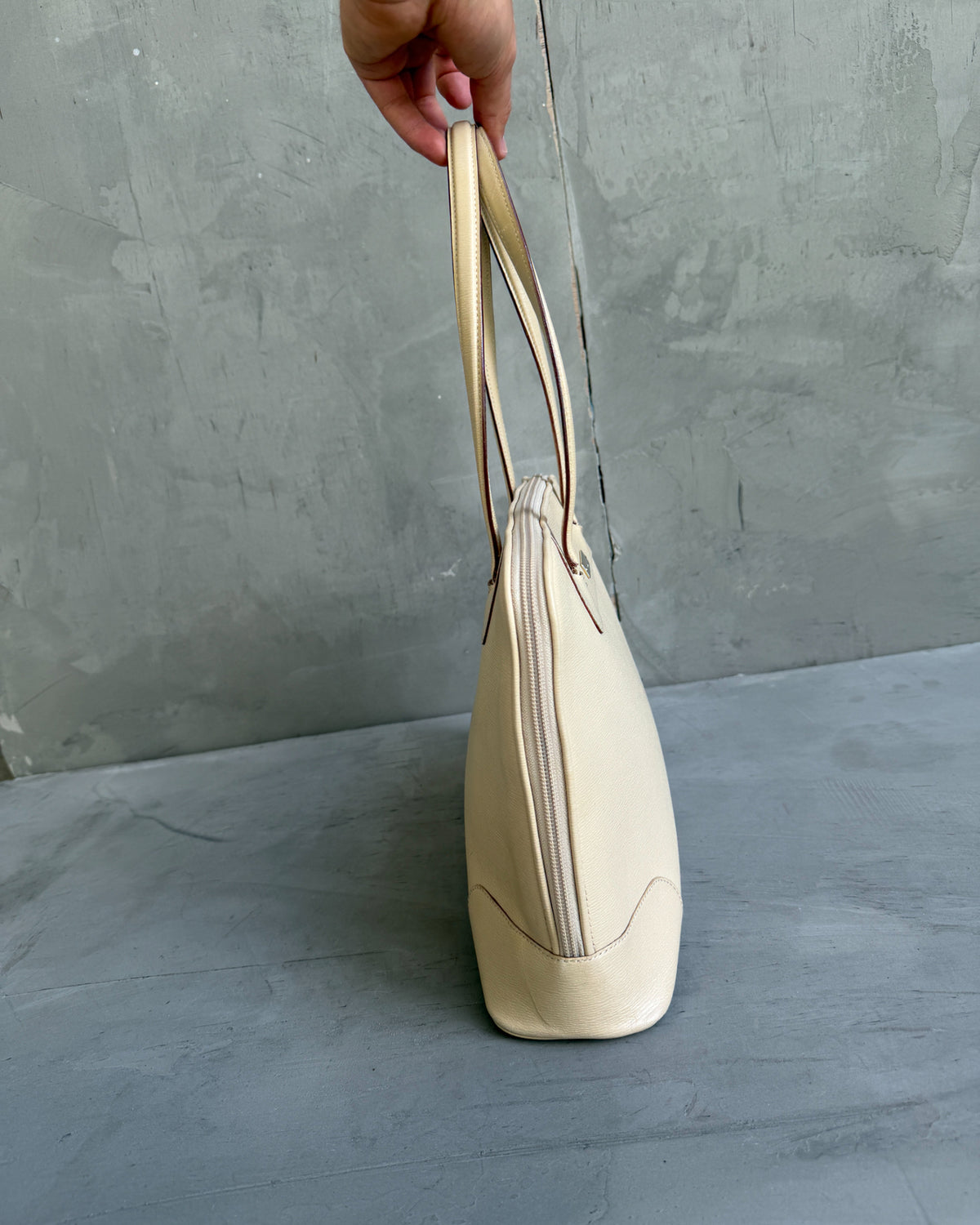 Gucci Beige Structured Leather Handbag-on a concrete background