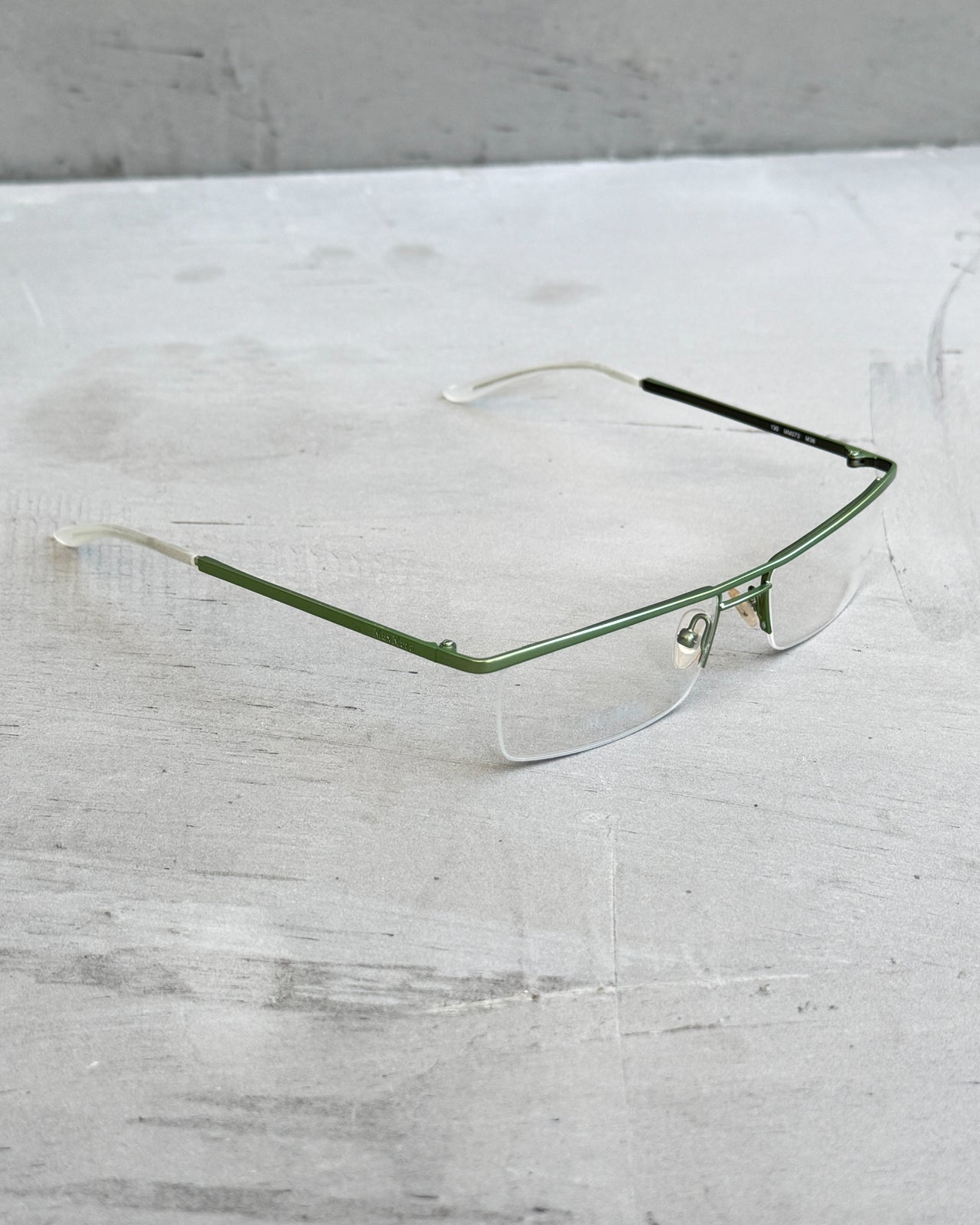 Max Mara Clear Lens Rimless Glasses-on a concrete background