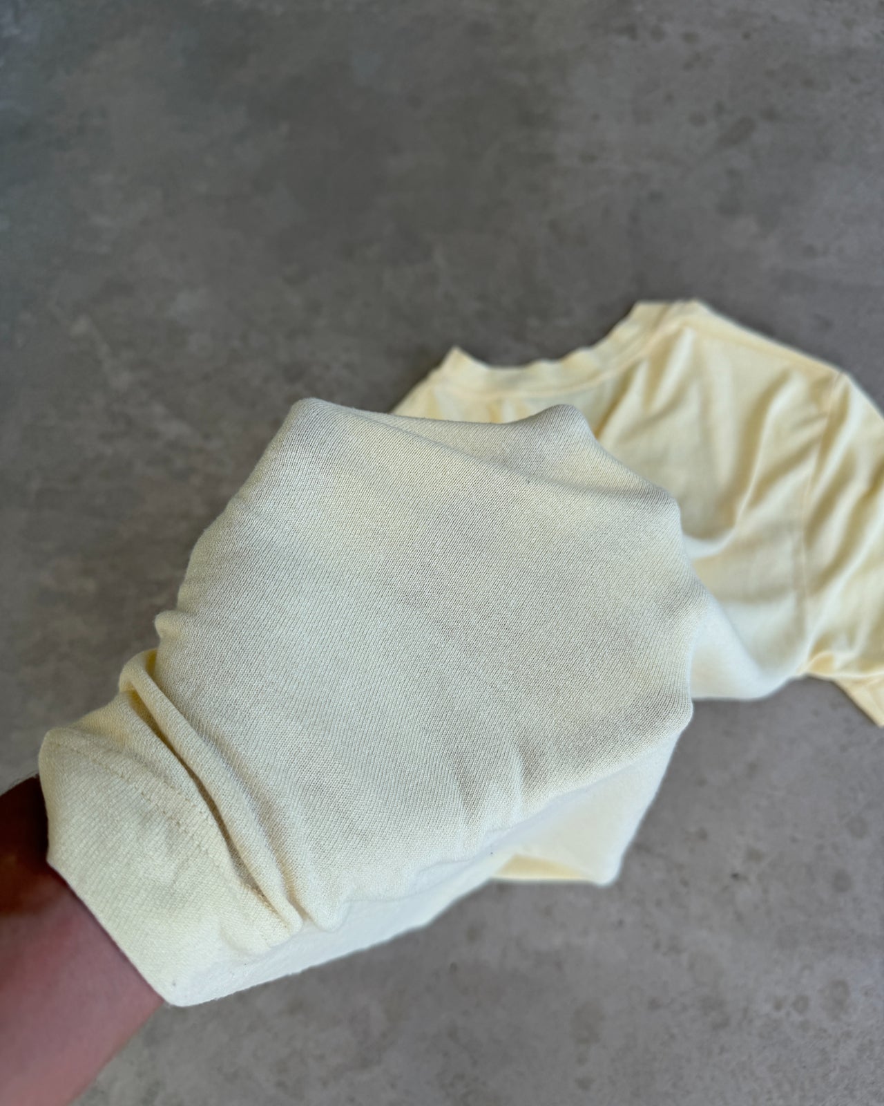 Dolce & Gabbana Yellow Viscose Semi Sheer V Neck T-Shirt – L-on a concrete background