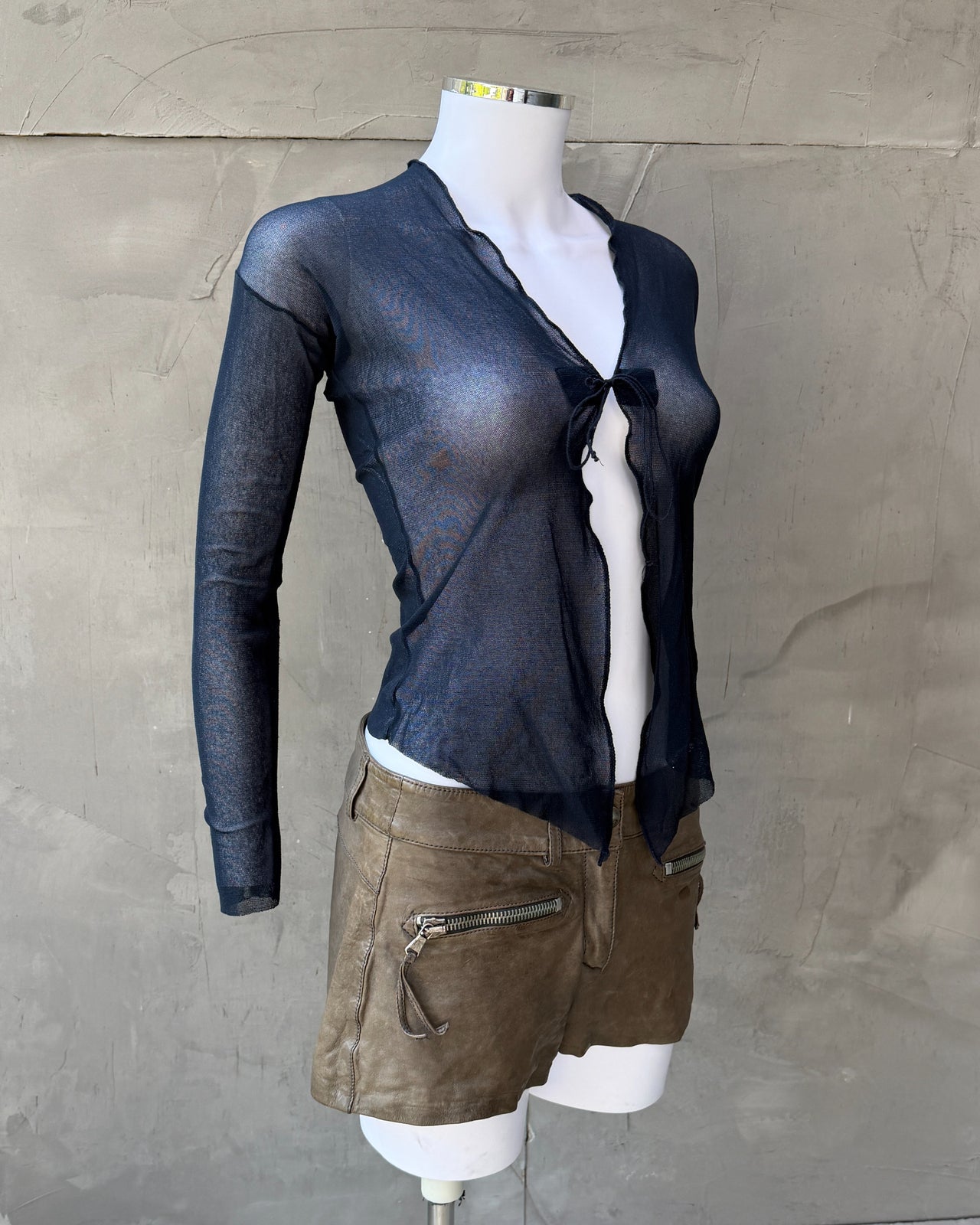 Jean Paul Gaultier Dark Blue Sheer Mesh Long Sleeve Cardigan Top – S-on a concrete background