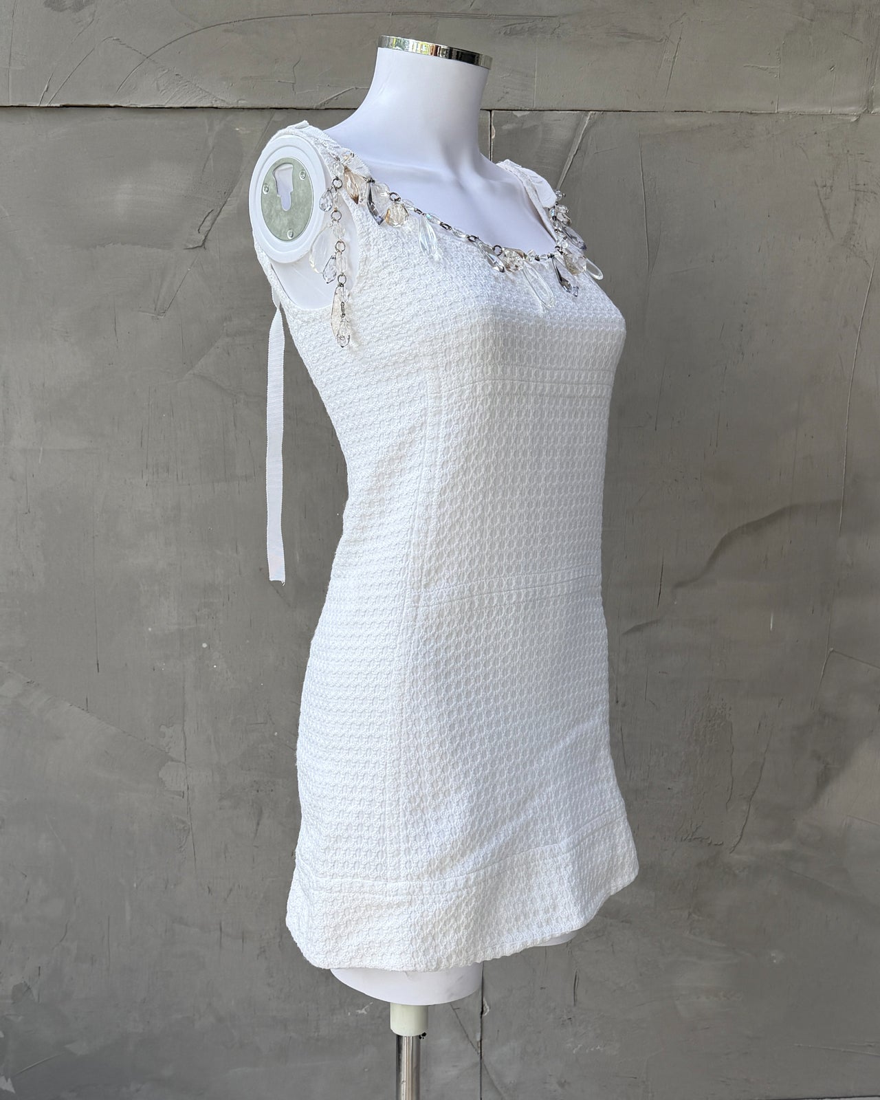 Prada SS2010 White Cotton Mini Dress-on a concrete background