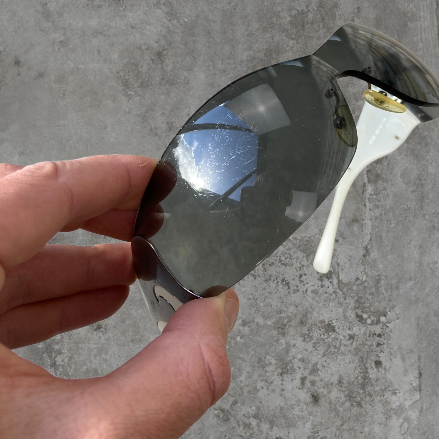 PRADA WRAP AROUND SWIRL SUNGLASSES