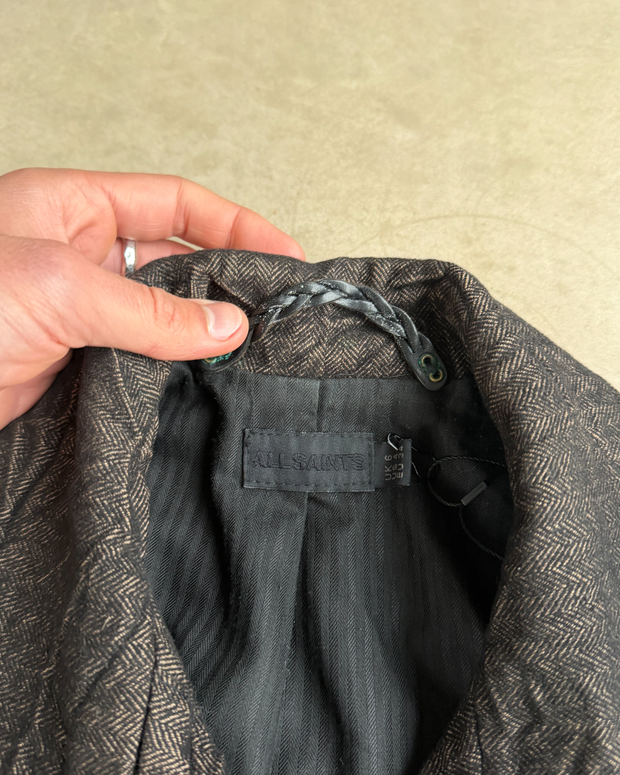 AllSaints Wool and Cotton Belted Jacket – XS-on a concrete background