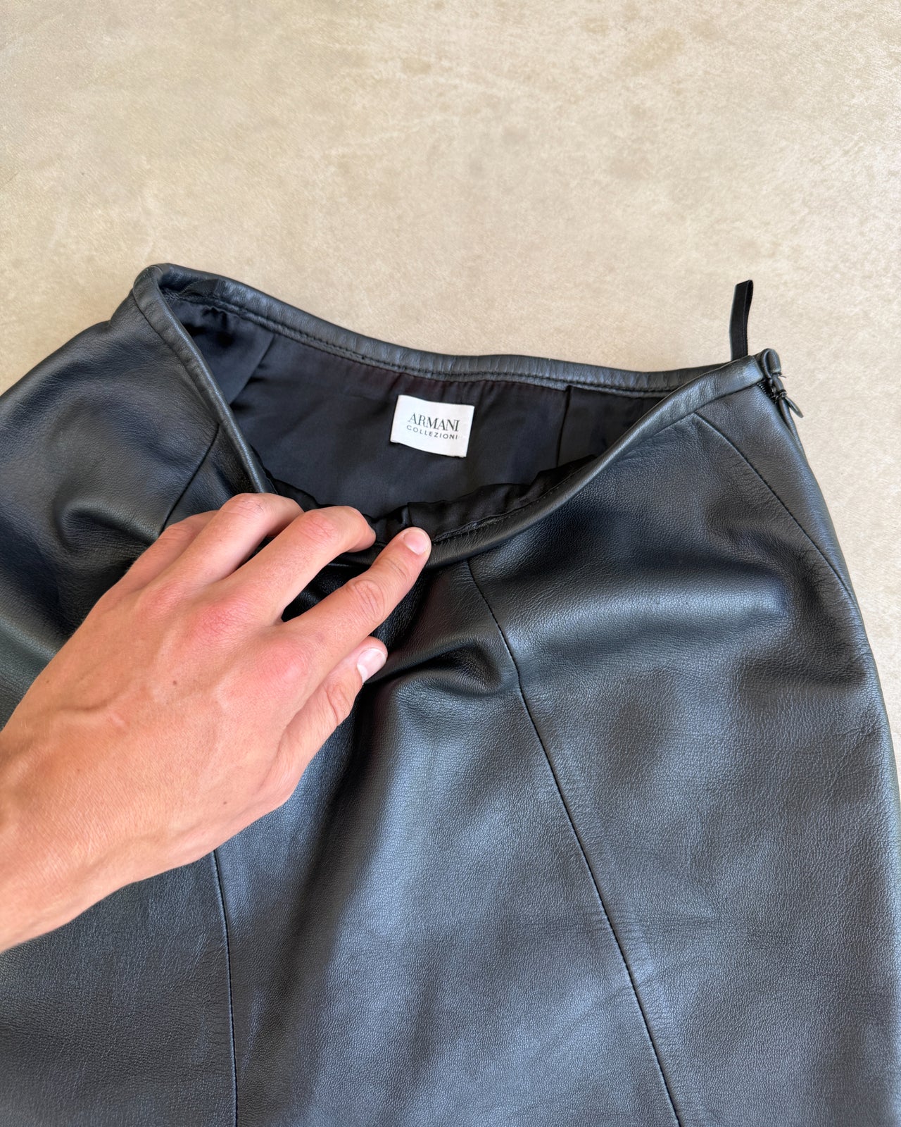 Armani Collezioni Leather Midi Skirt – XS-on a concrete background