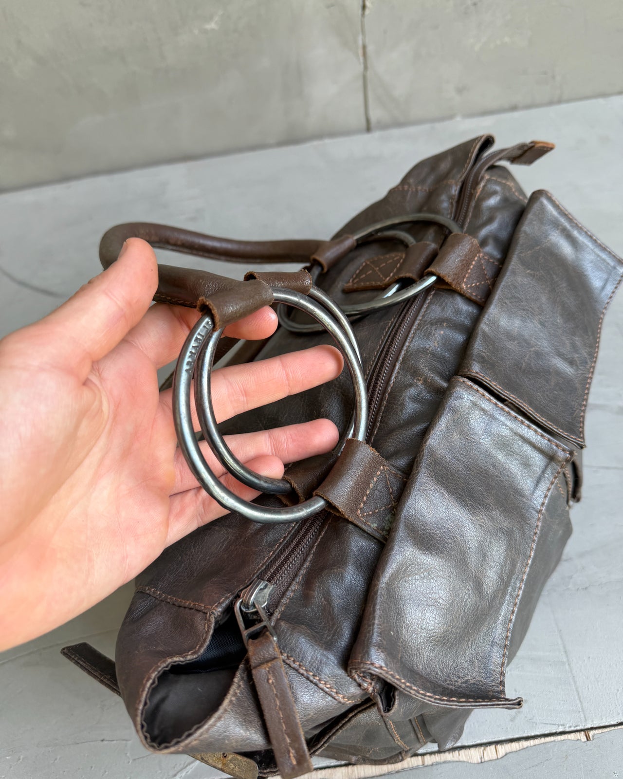 Armani Jeans Brown Leather Handbag-on a concrete background