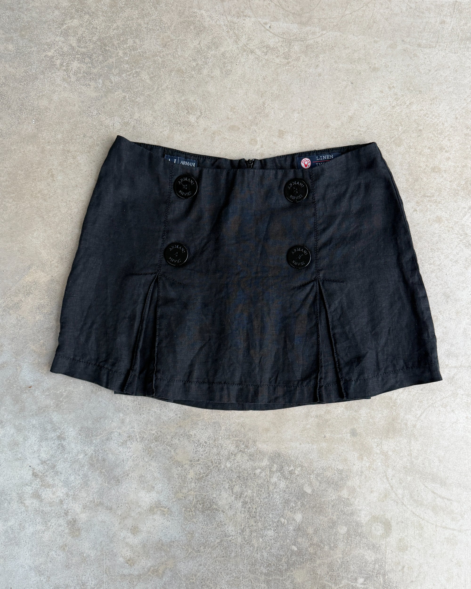 Armani Jeans Linen Mini Skirt – XS-on a concrete background