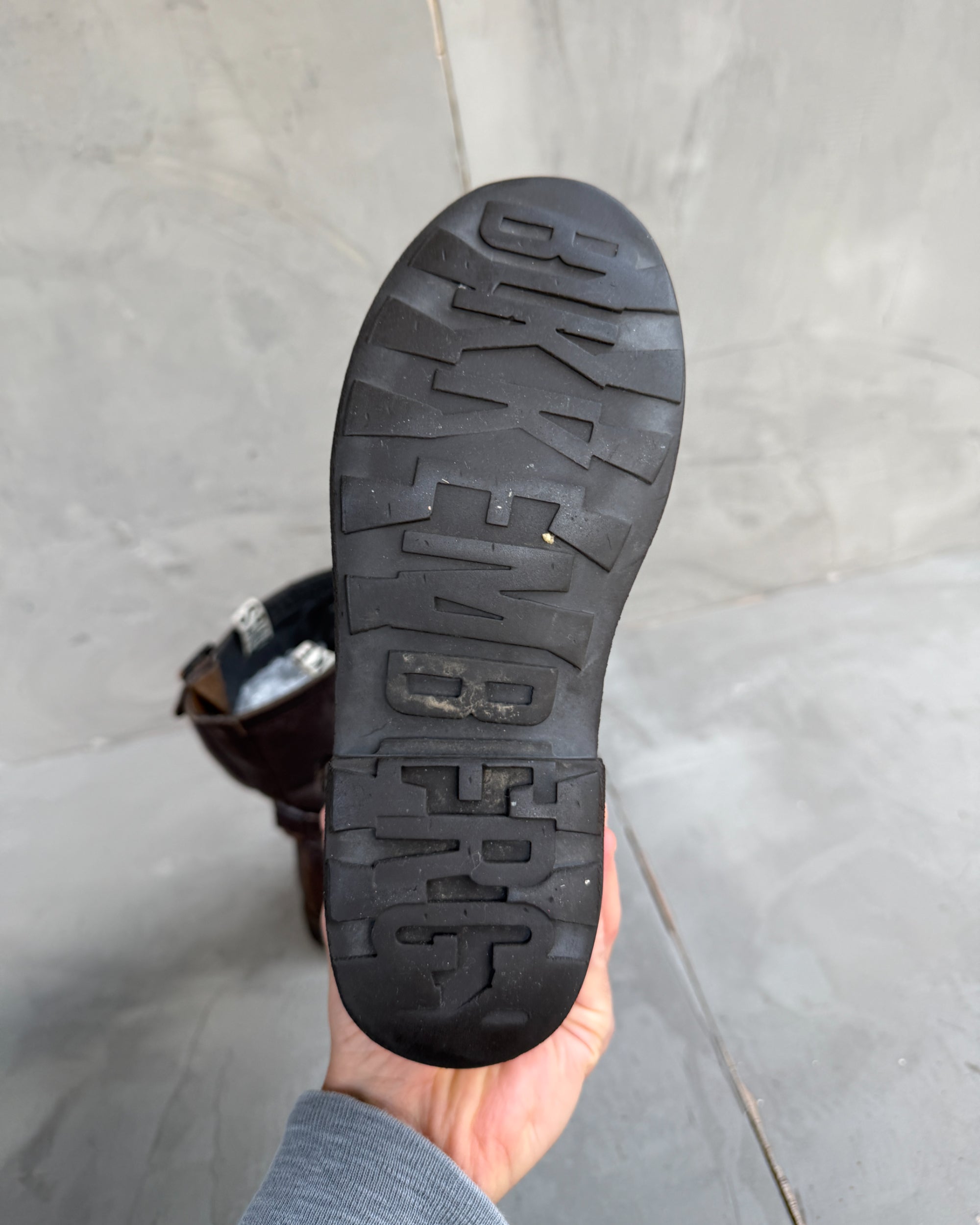 Bikkembergs Slushy Leather Boots with Buckle – EU 36-on a concrete background