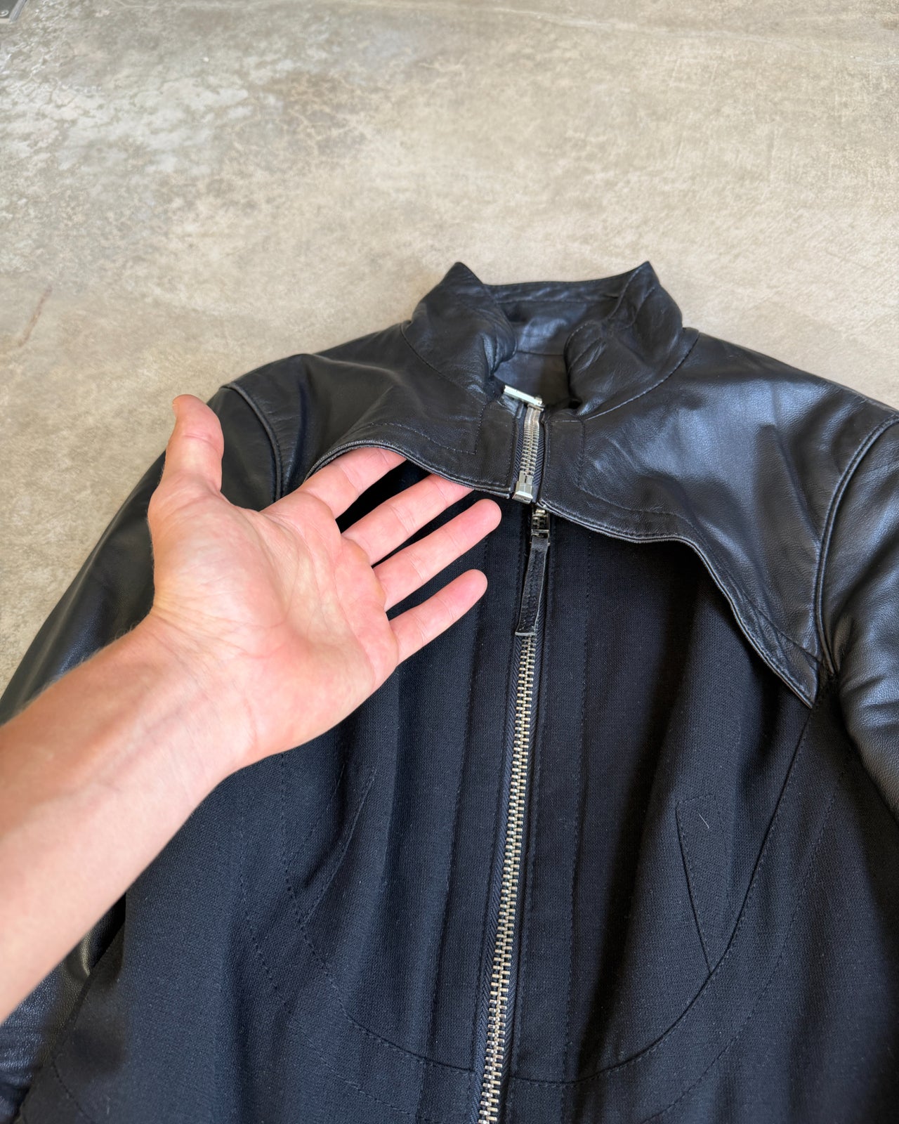 Black Double Layer Leather and Fabric Jacket – M-on a concrete background