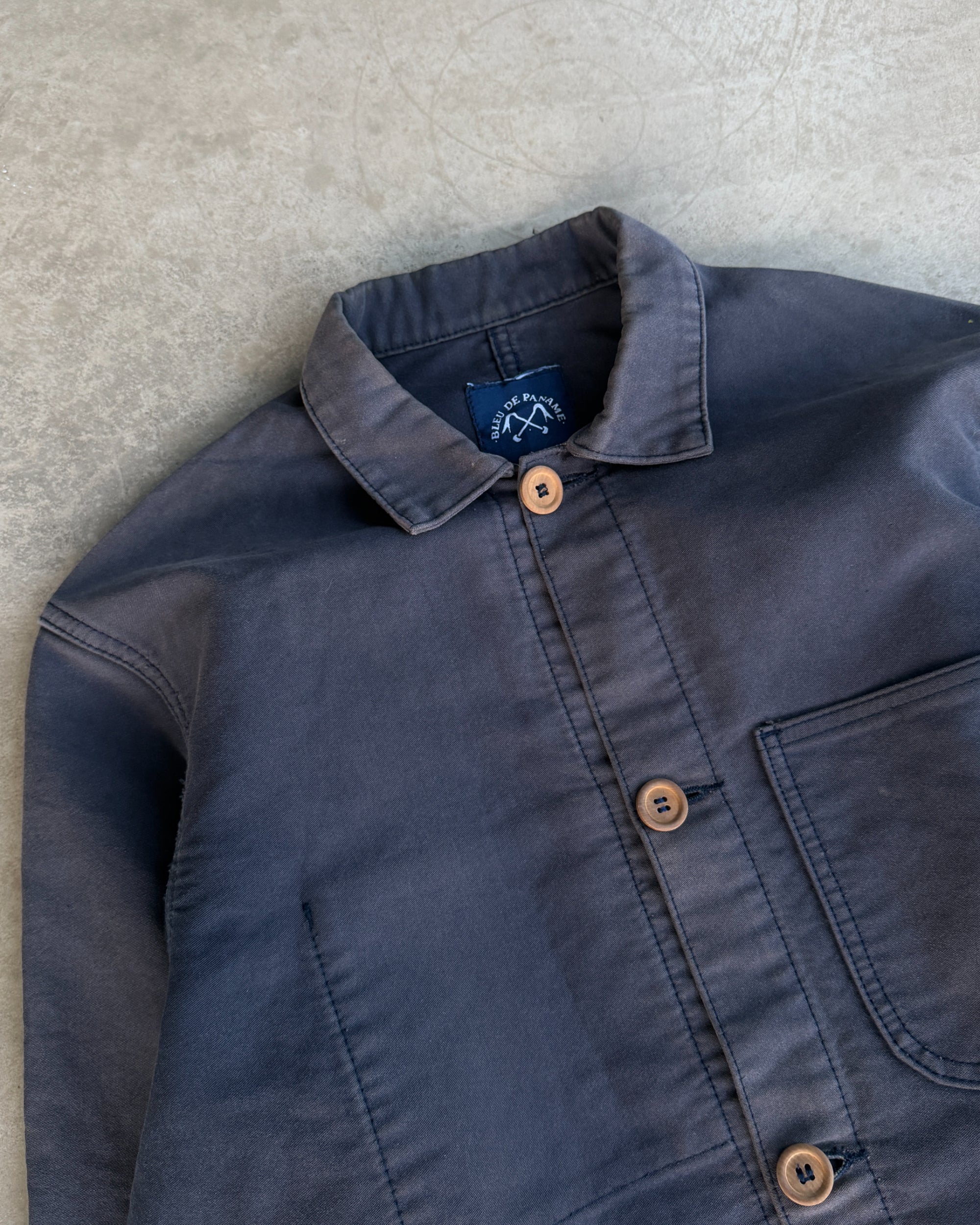 Bleu de Paname French Workwear Jacket – M-on a concrete background