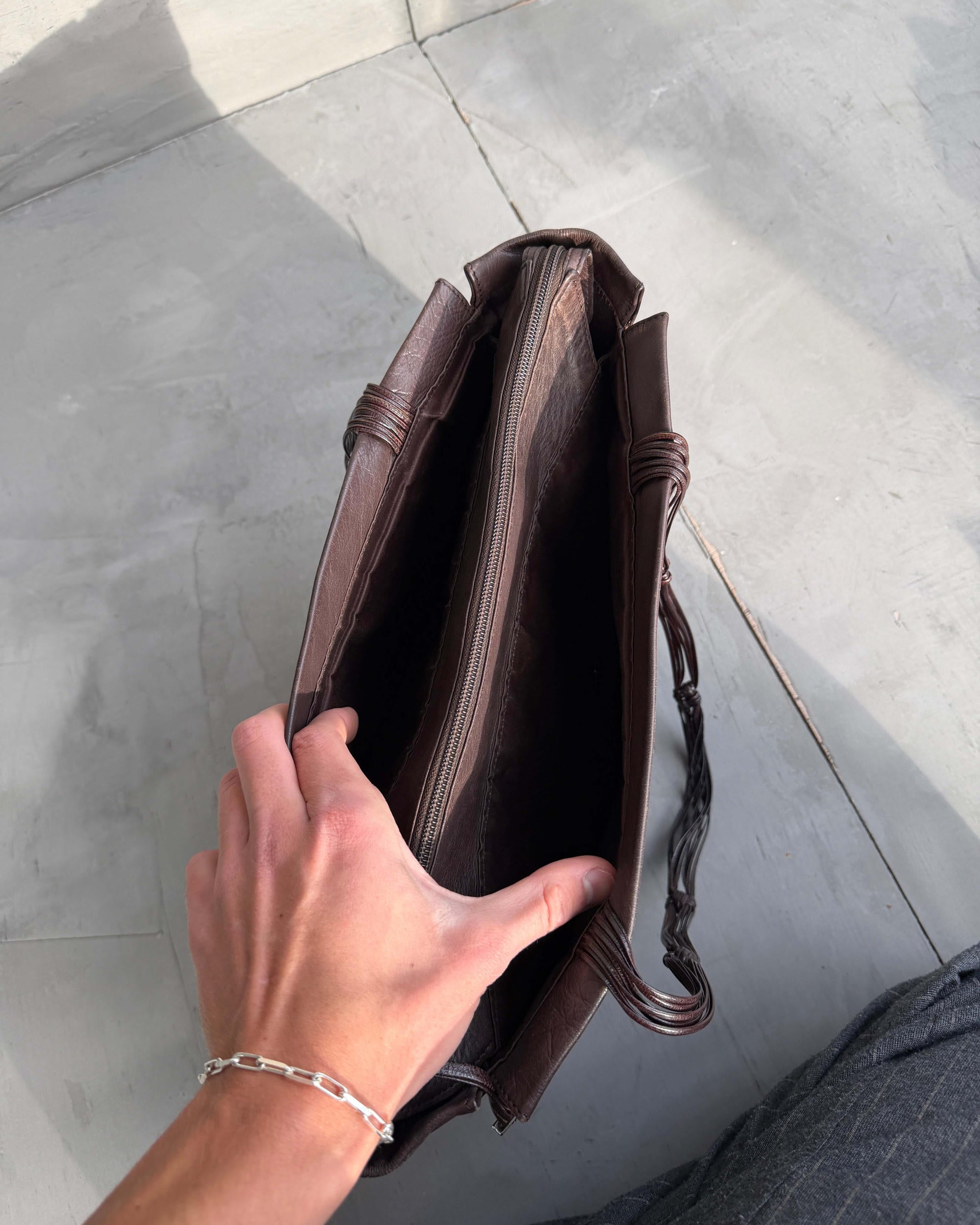 Stephane Kellan Leather Tote Bag-on a concrete background