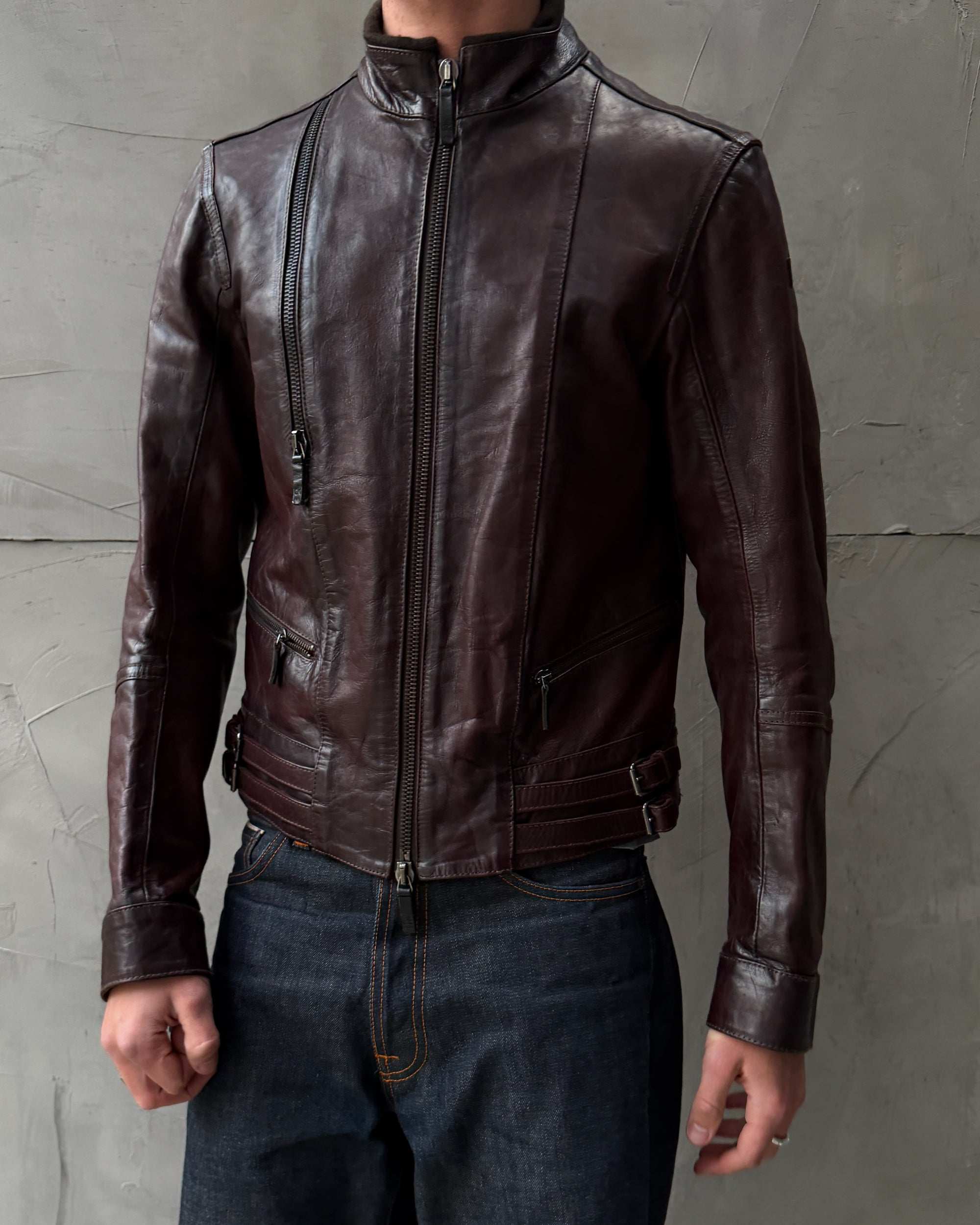 Calvin Klein Buckle Leather Jacket – M-on a concrete background