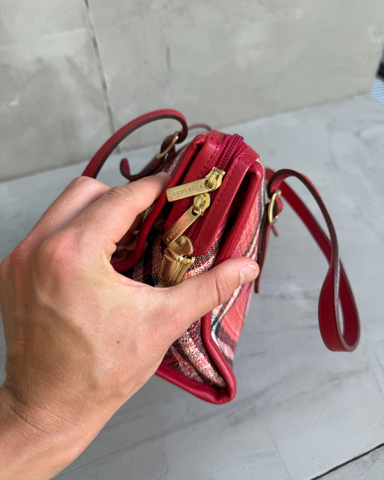 Burberry Blue Label Nova Print Red Bag-on a concrete background