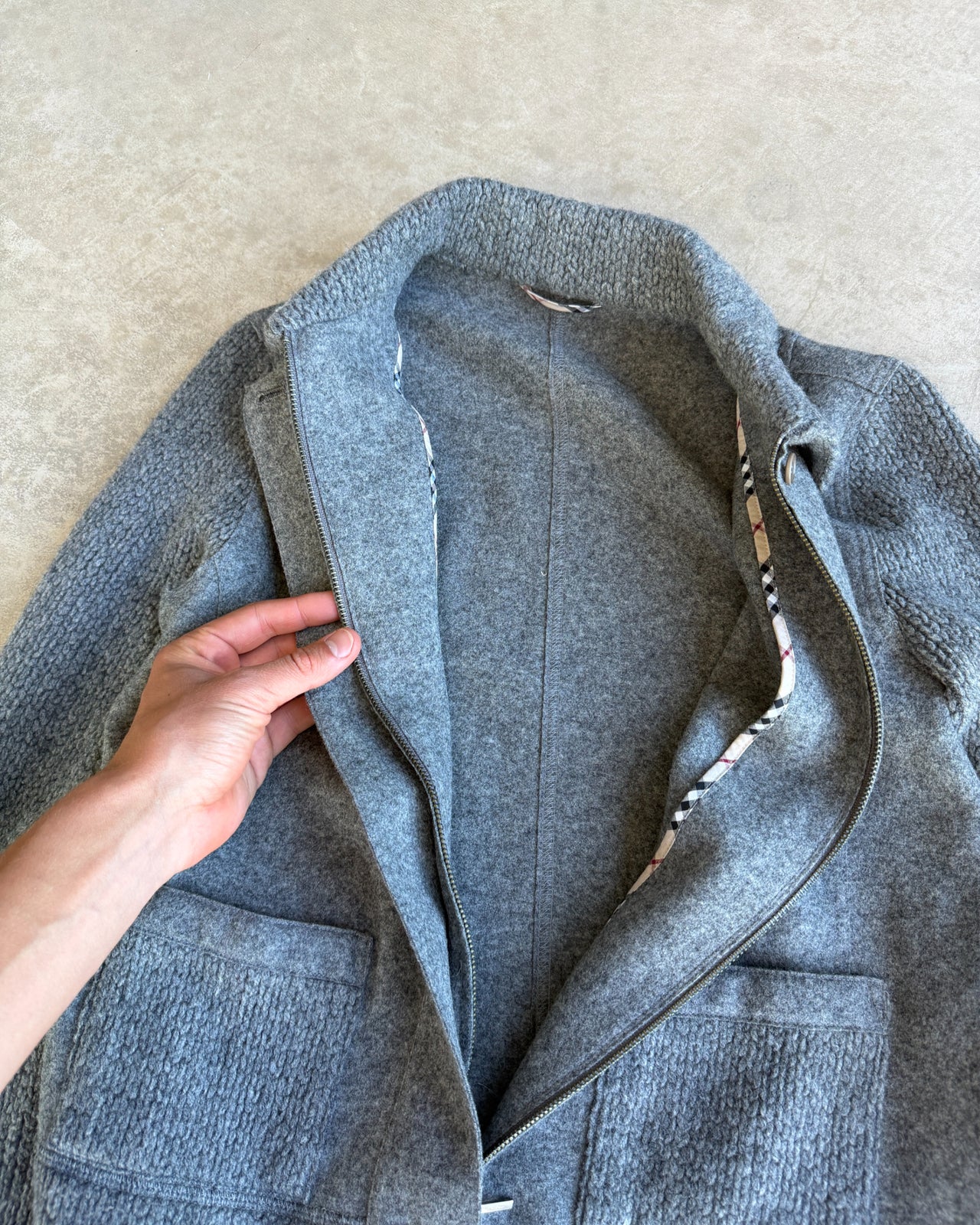 Burberry Grey Wool Knit Zip Up Sweatshirt – S-on a concrete background