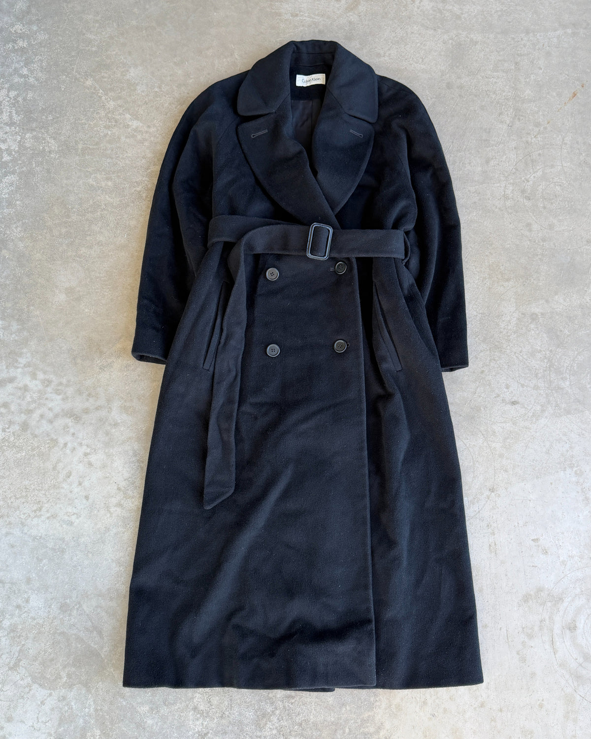 Calvin Klein Wool Trench Coat – L-on a concrete background
