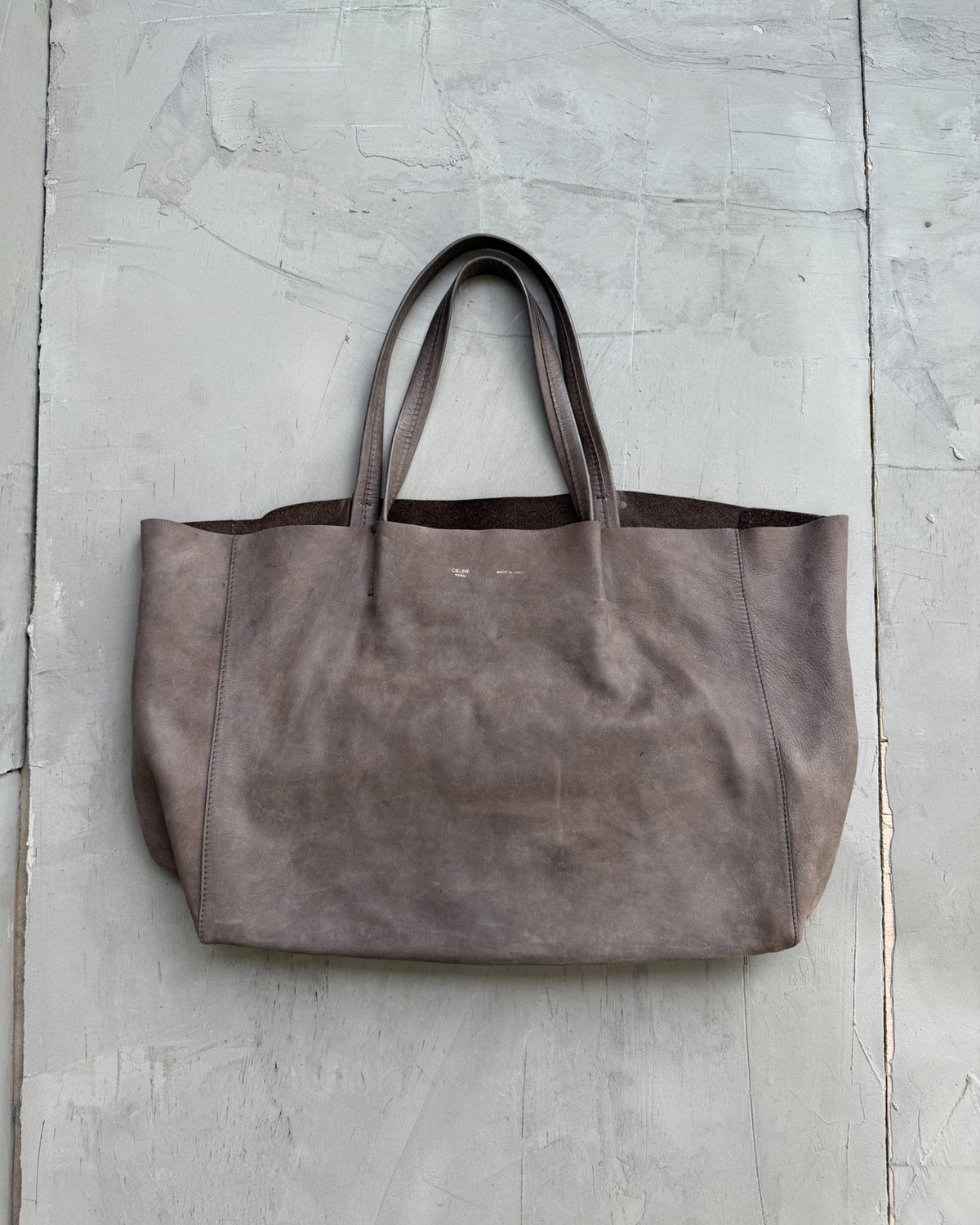 Celine Brown Leather Tote Bag-on a concrete background