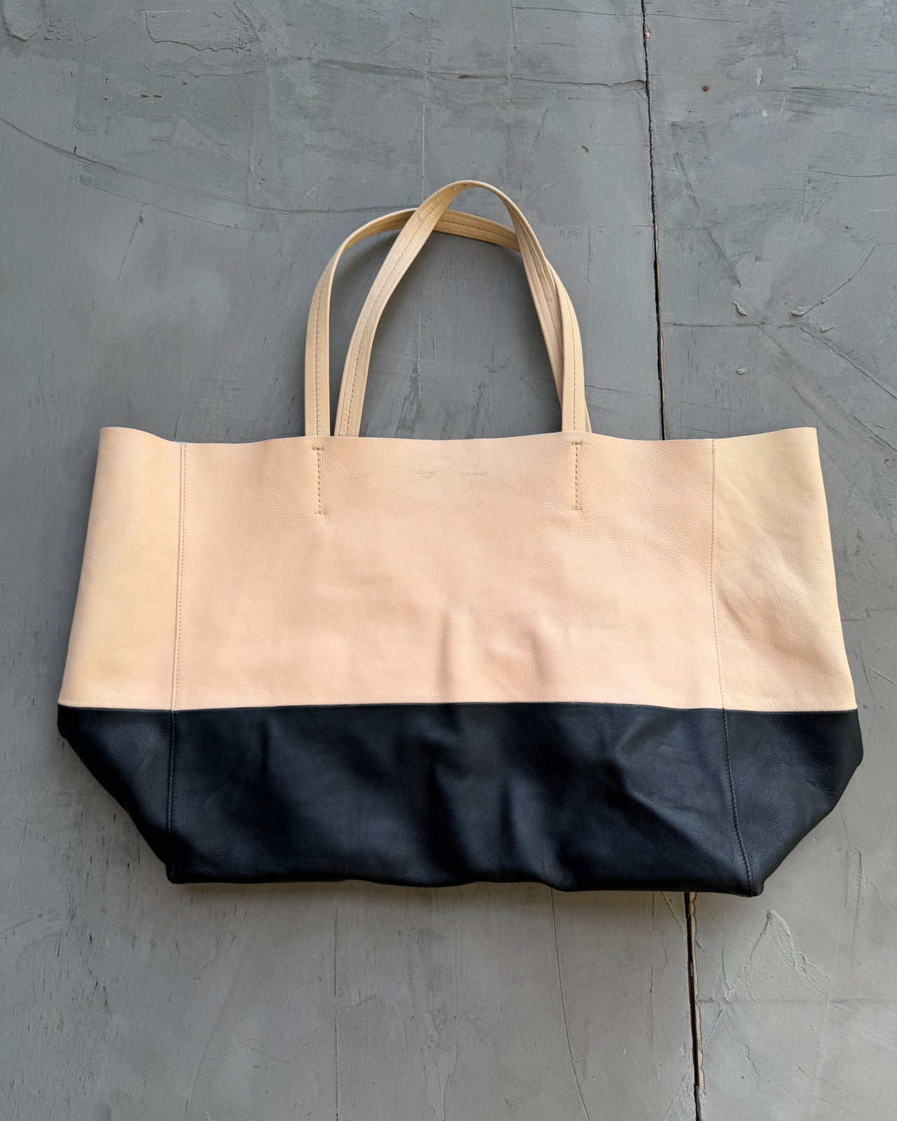 Celine Two Tone Leather Tote Bag-on a concrete background